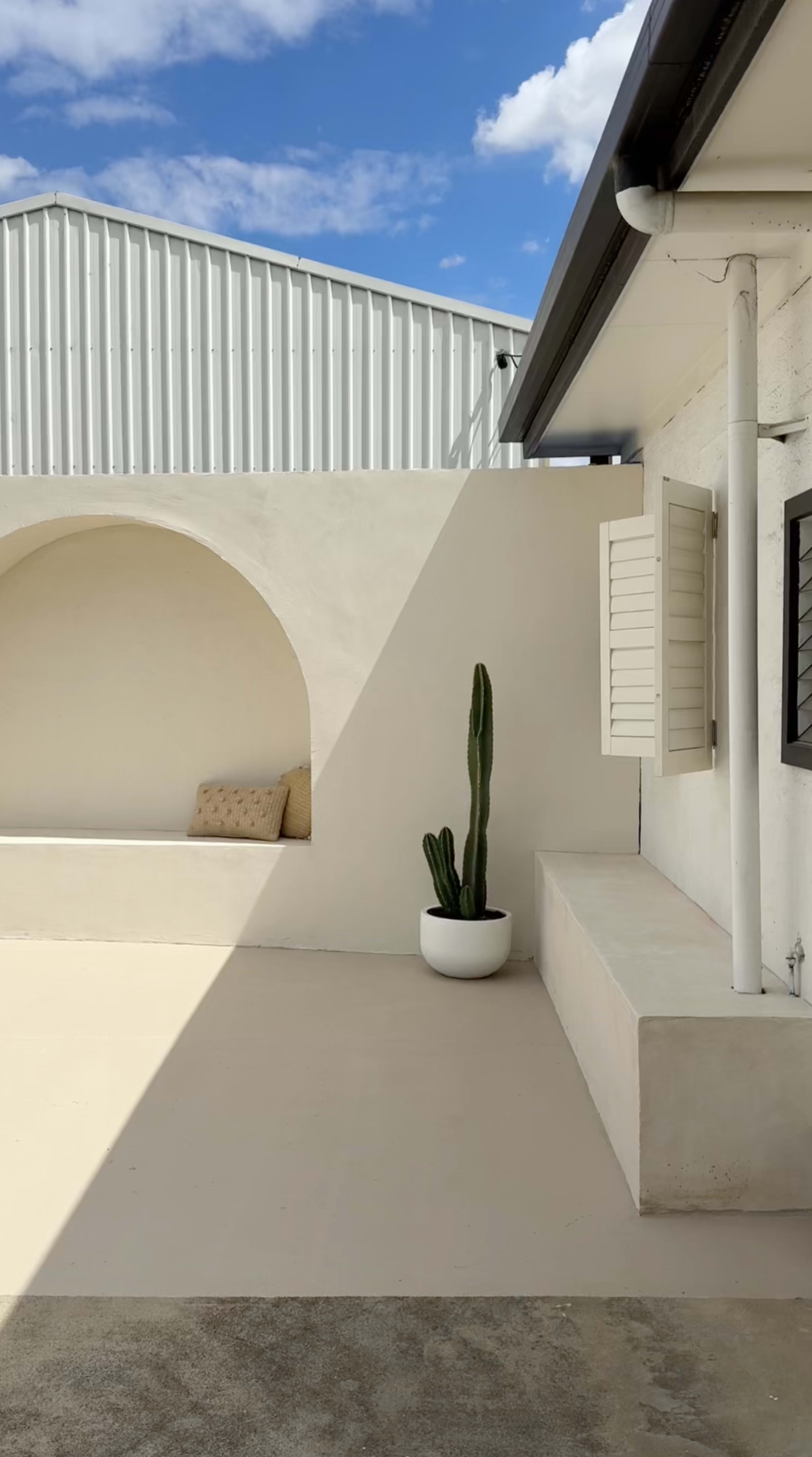 Bali-Inspired Outdoor Courtyard with Rendered Arch and Shower Image in , Airport West, VIC