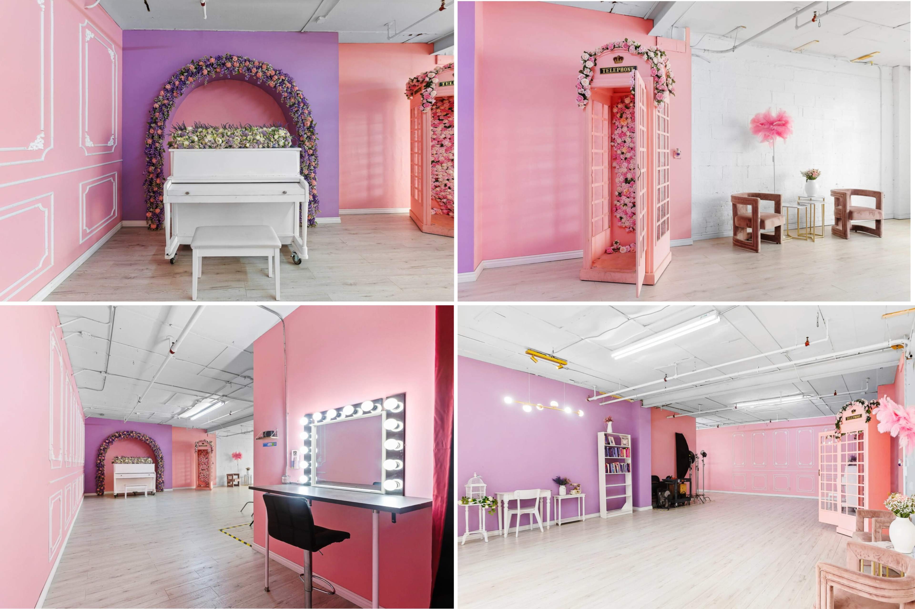 A stylized studio space with pink and white walls, featuring areas with floral decorations, a piano, and a lighted vanity mirror.