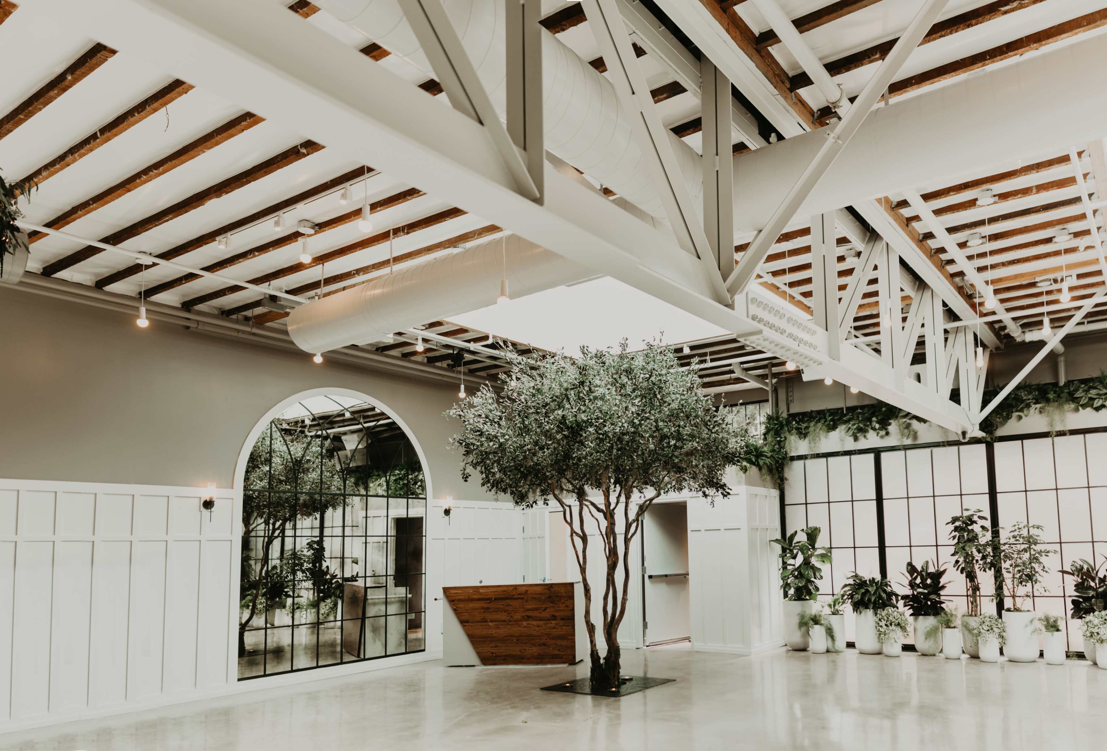 Downtown private event space with lofted ceilings and lush interior greenery. Image in East Village, San Diego, CA