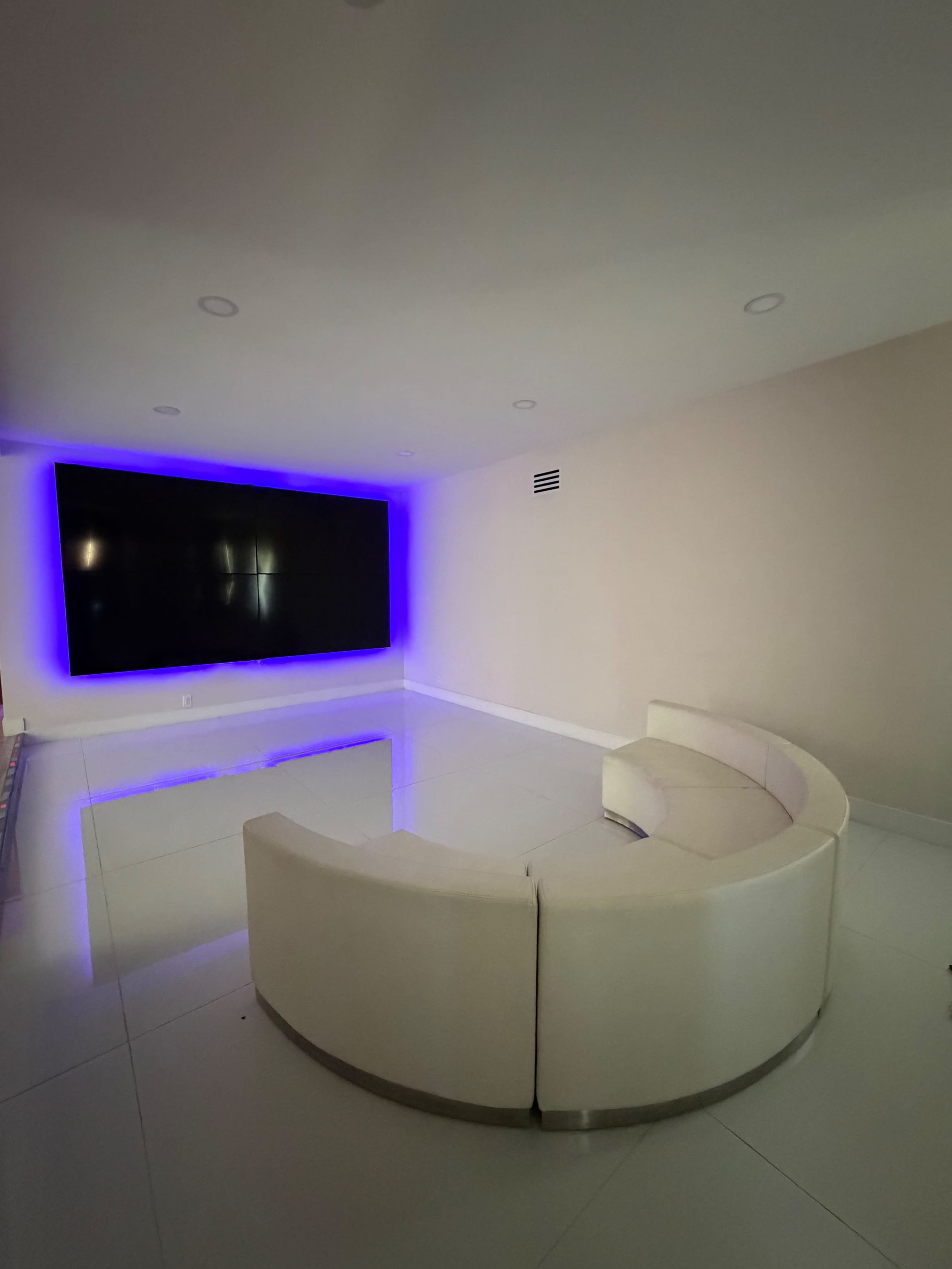 Modern White Room with TV Wall Image in The Section 10, Las Vegas, NV