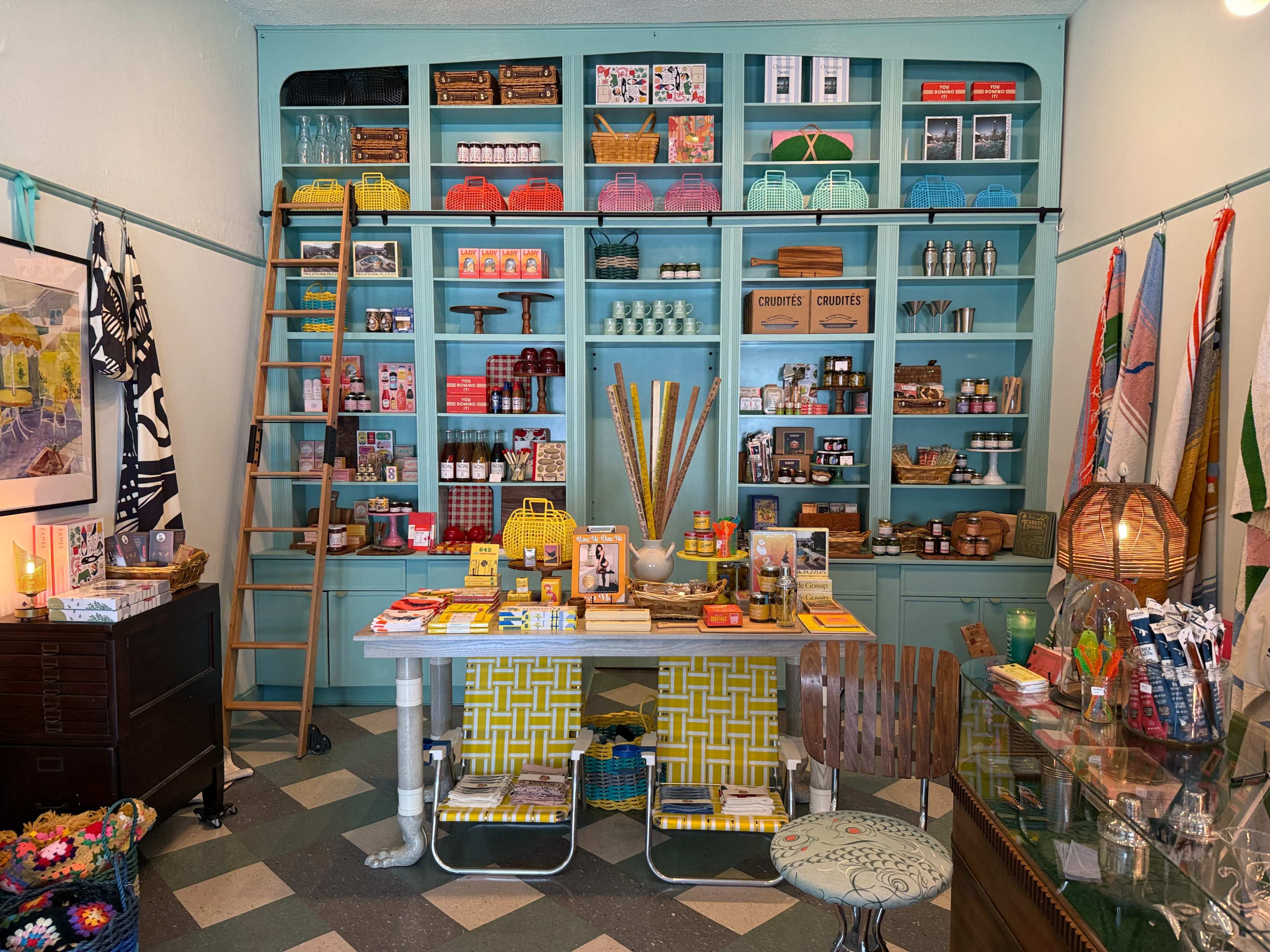 Accidentally Wes Anderson small retail gift shop with timeless feel and rolling ladder Image in Koreatown, Los Angeles, CA