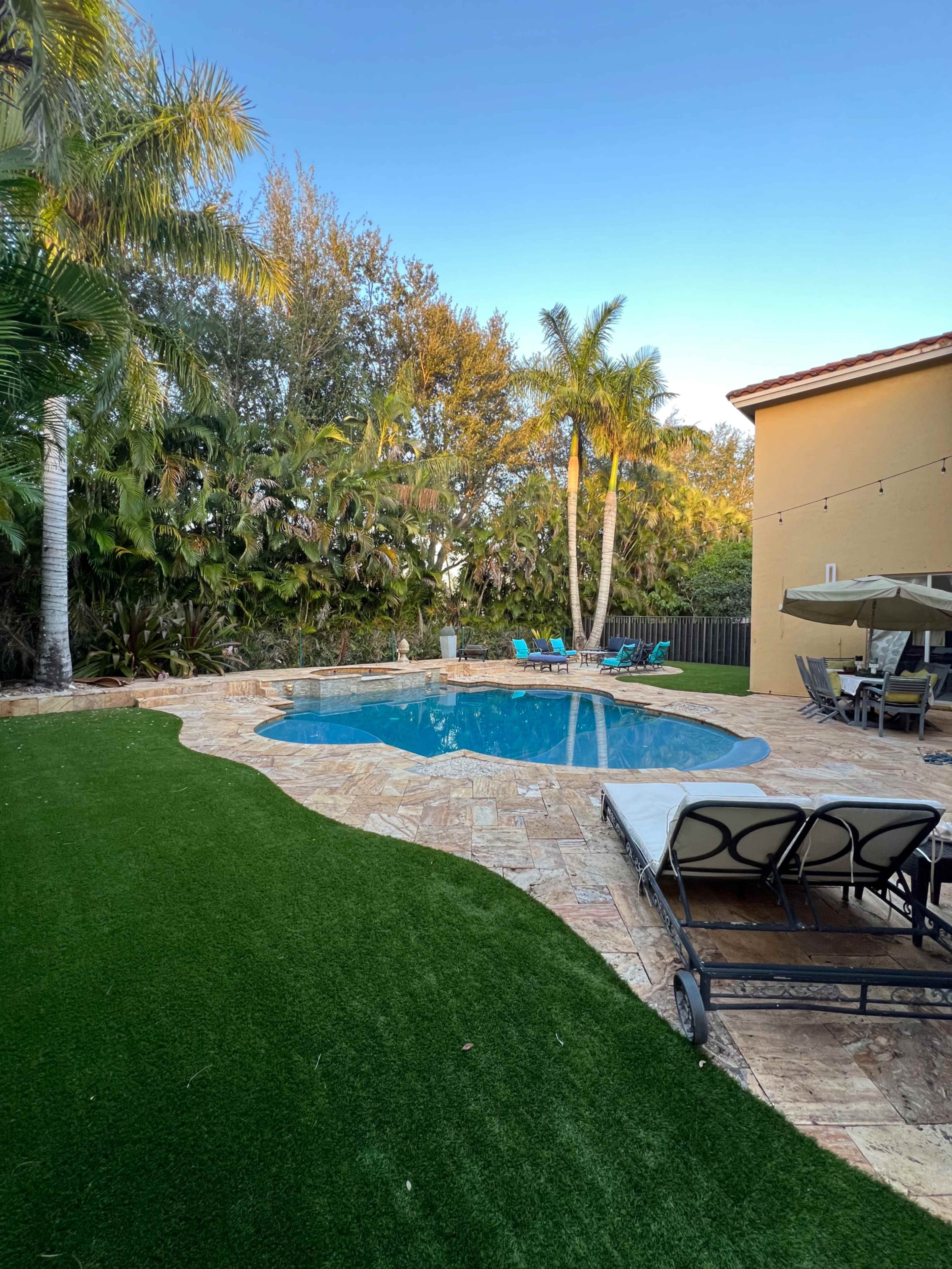 Spacious Backyard and Lanai With Pool Image in , Lake Worth, FL