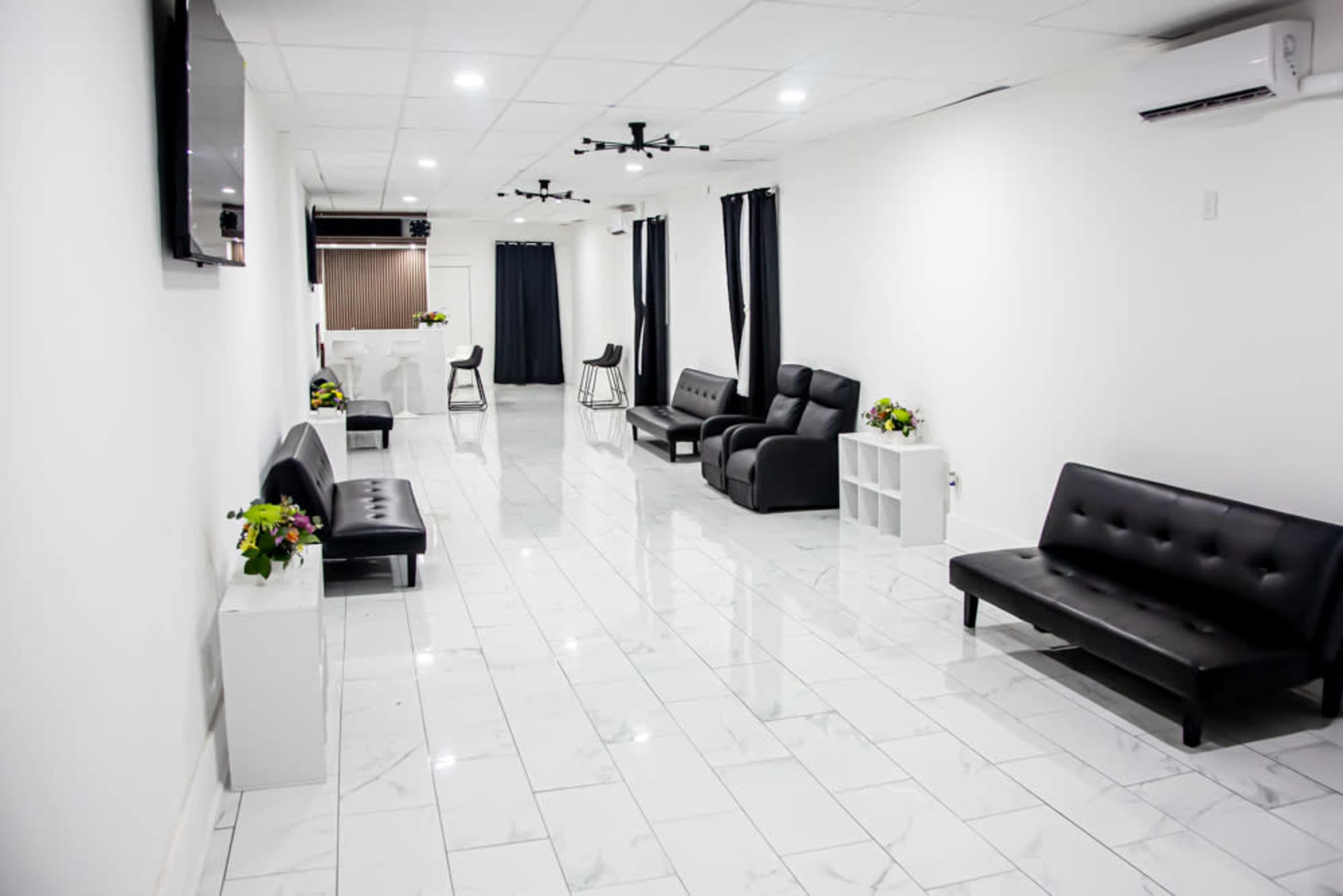Elegant Black & White Space with Marble Floors and a Wood-Finished Bar Image in Hempstead, Baldwin, NY