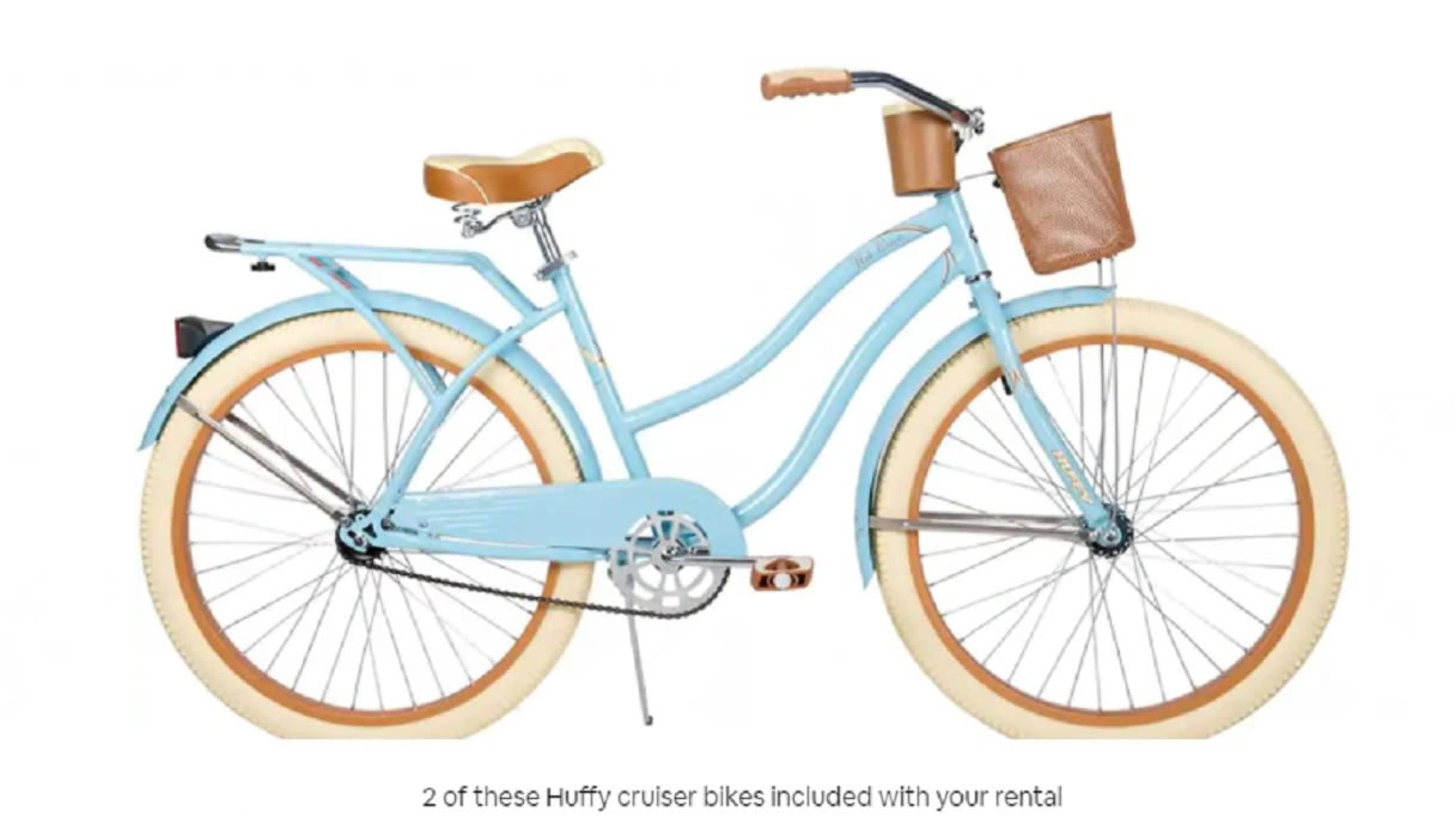 The image shows a blue Huffy cruiser bike with tan accents and a front basket.