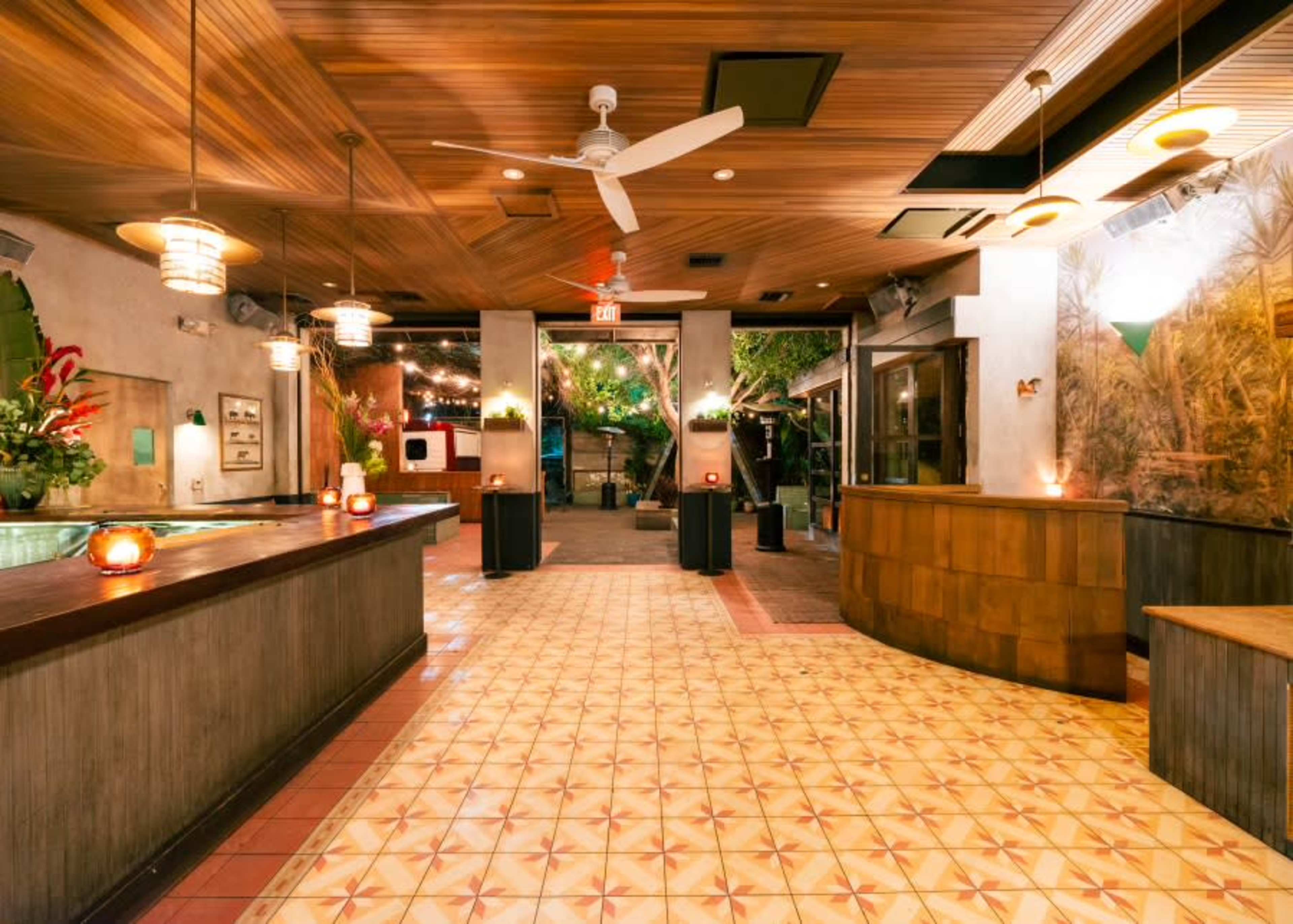 indoor outdoor patio bar with lush greenery and vine trellised canopy Image in Silver Lake, los angeles, CA
