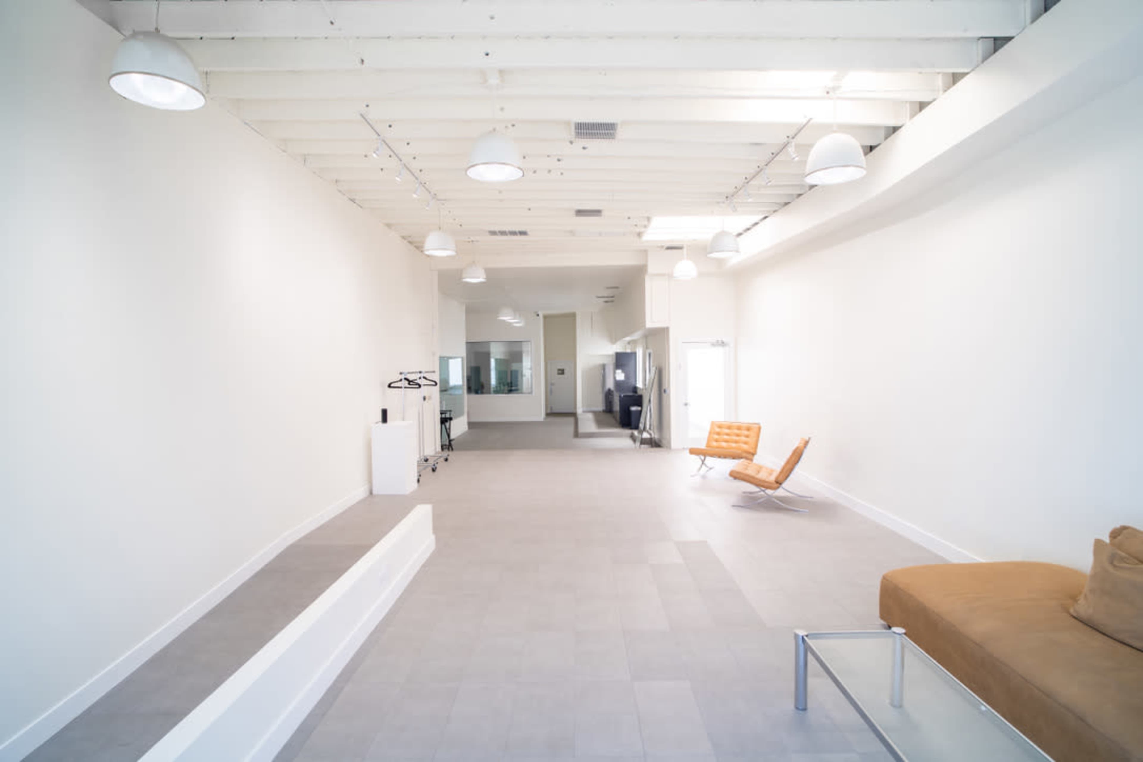 Melrose Fairfax District Minimalist Daylight Photo Video Pop-Up Studio Space with Modern Minimalist Furnishings and Backdrops Image in Beverly Grove, Los Angeles, CA