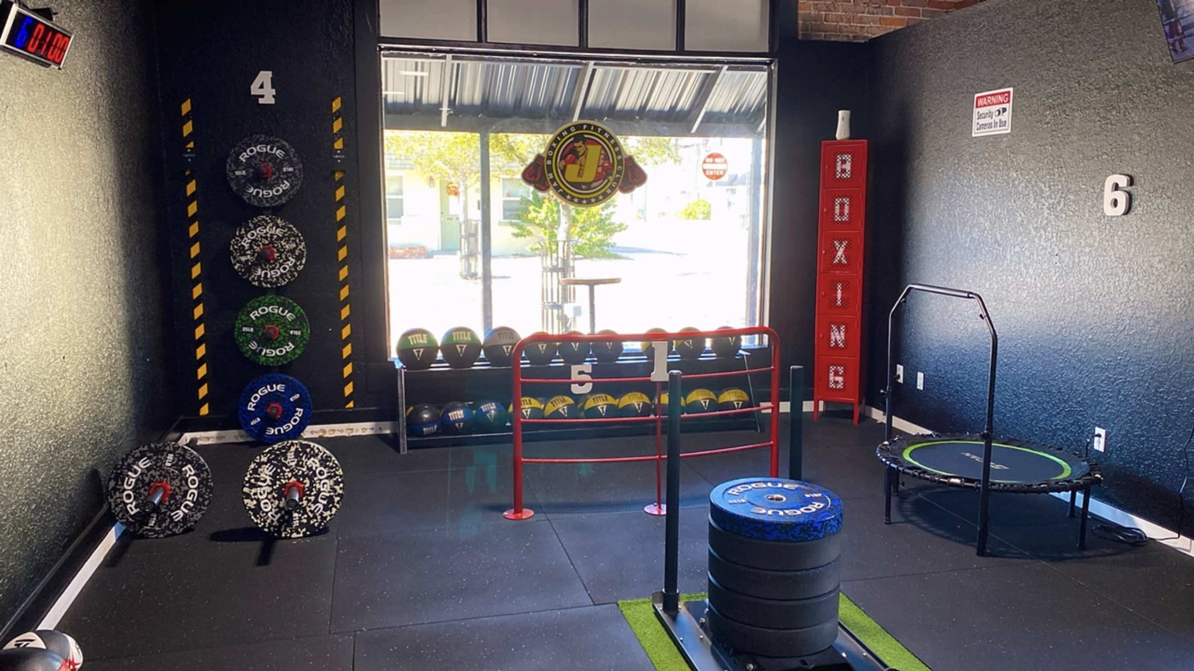 Full Boxin Gym / Boxing Ring / Punching Bags / Weights Area (Old Bricks Walls) (Black Walls) Downtown Saint Cloud Fl Image in St. Cloud, Saint Cloud, FL