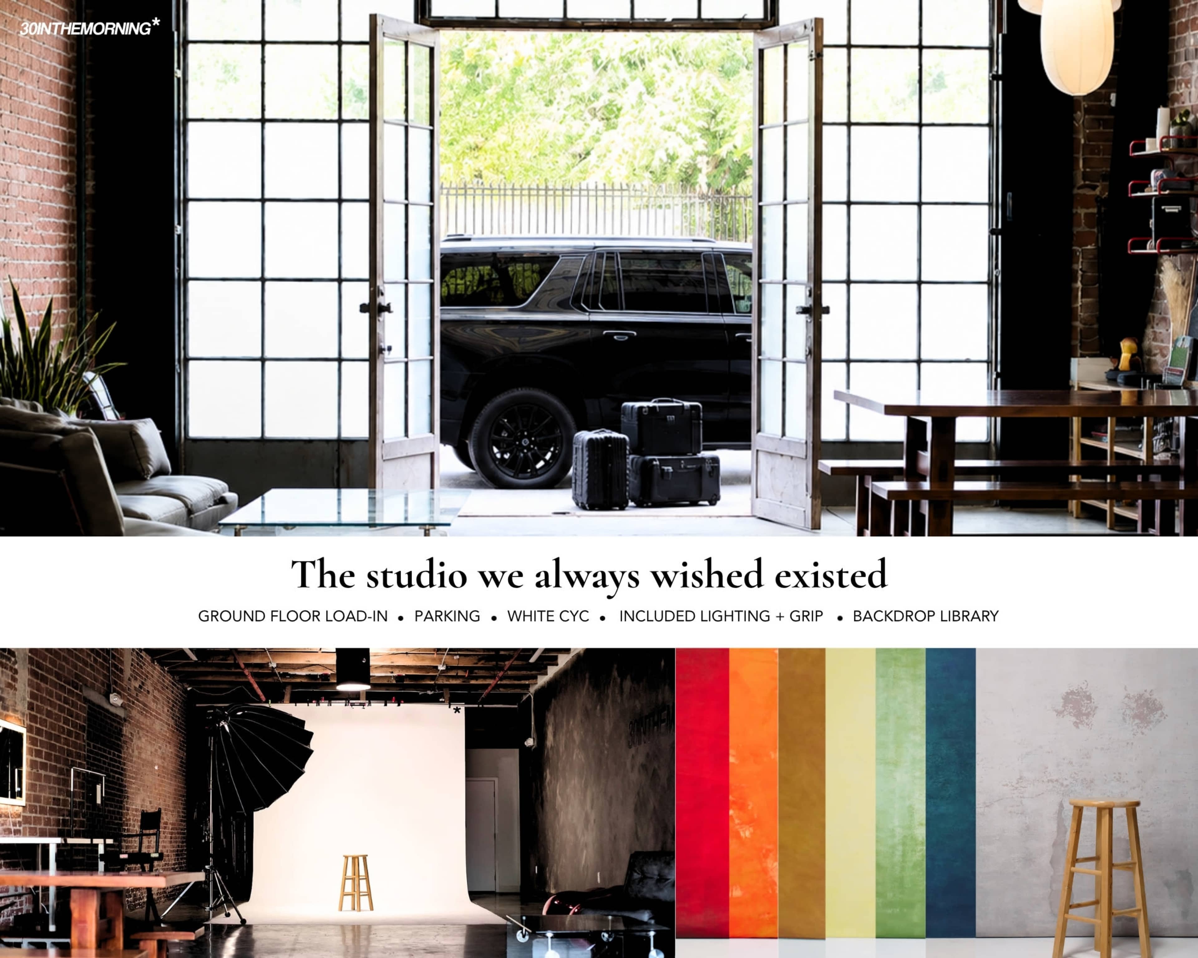 A spacious studio space features a large entrance with double glass doors, showcasing a vehicle parked outside and various photography equipment arranged inside.