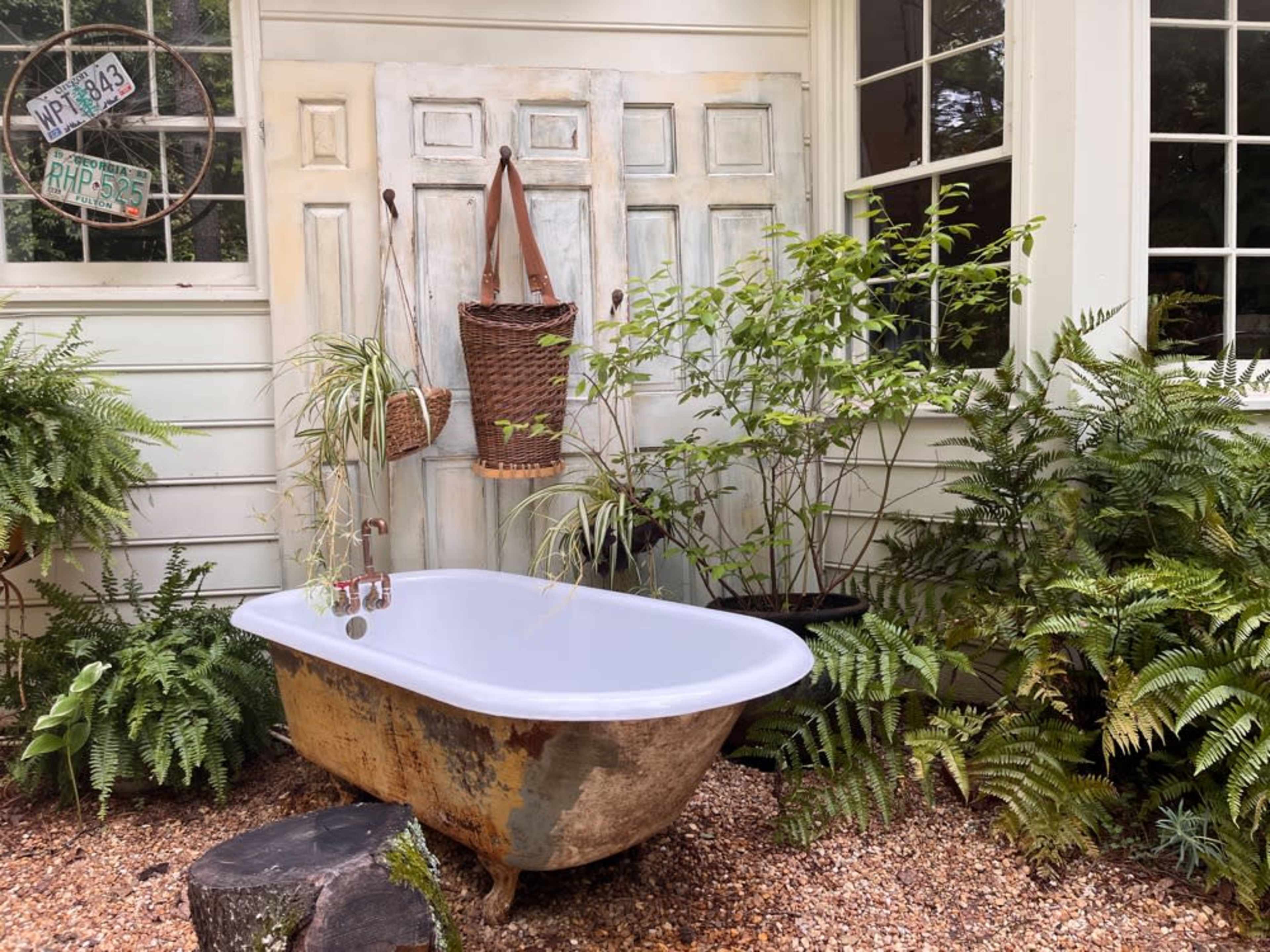 Plumbed, cast iron tub