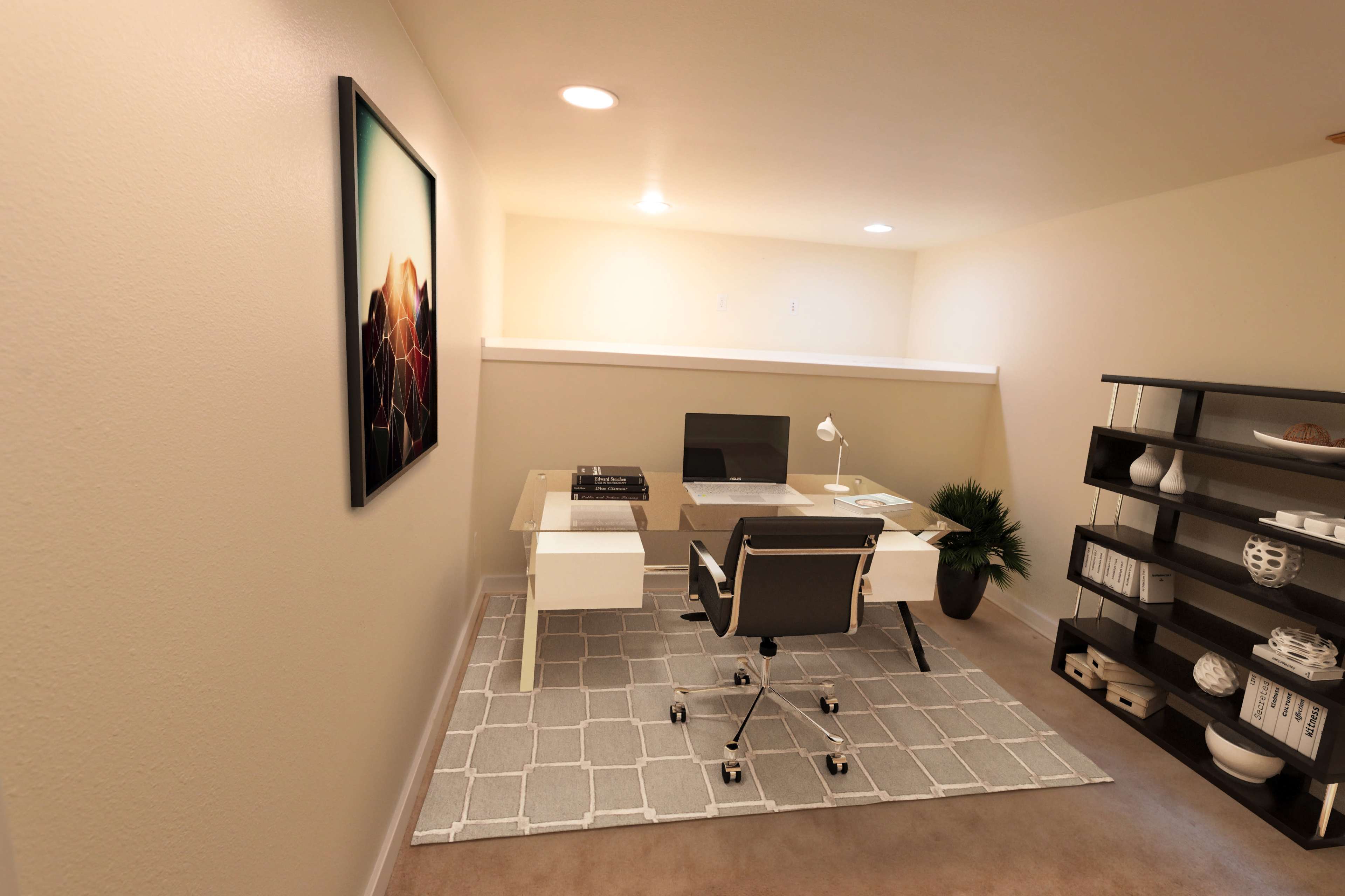 The image shows a small, well-lit office space with a glass desk, a black chair, a decorative plant, and a shelf displaying various items.