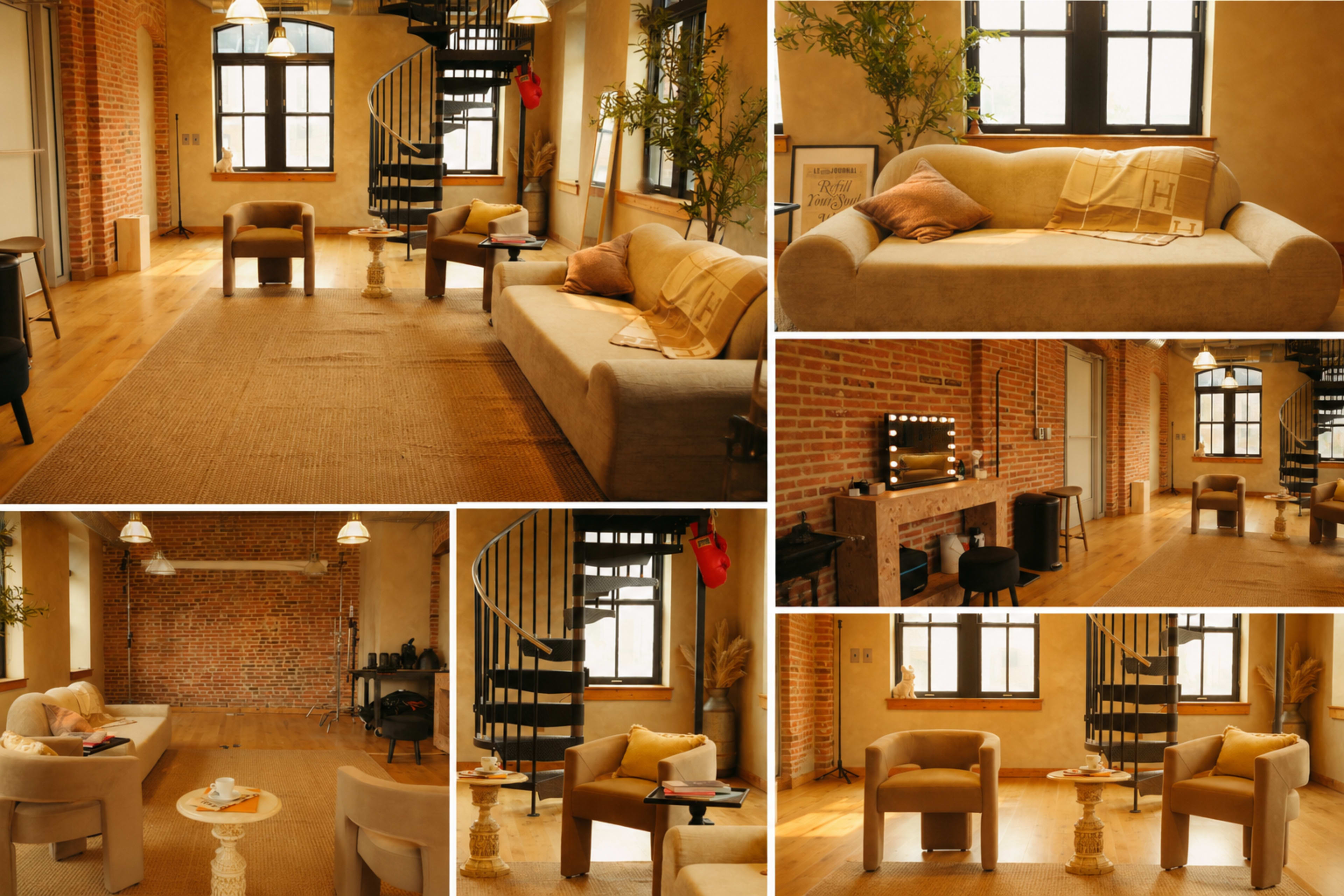 The image features a cozy interior room with wooden floors, brick walls, and a spiral staircase, furnished with a beige sofa, two armchairs, and various decorative elements.