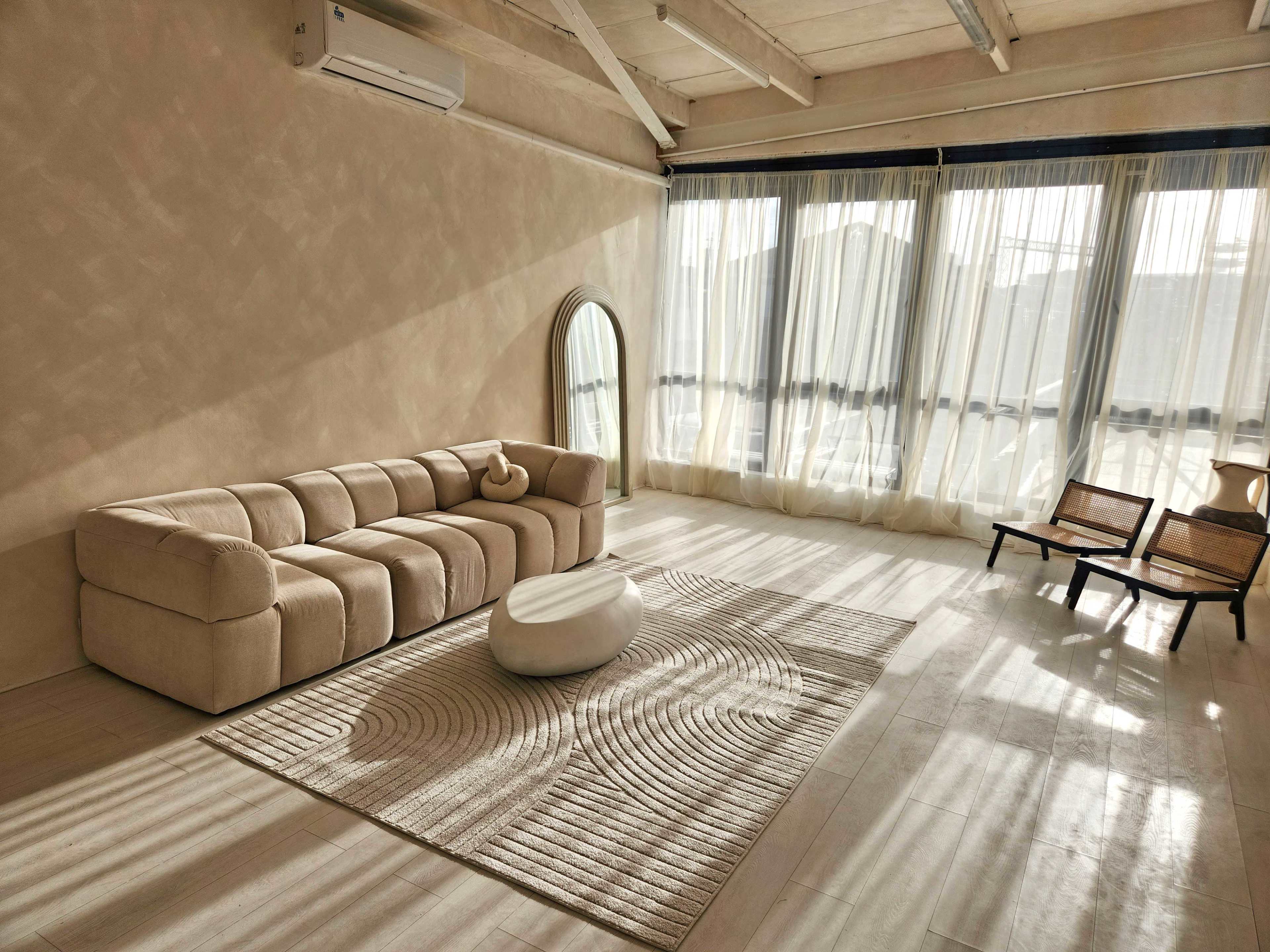 Sun-Kissed Lifestyle Studio with Elegant Arches & Textured Walls Image in London, Canning Town, ENG