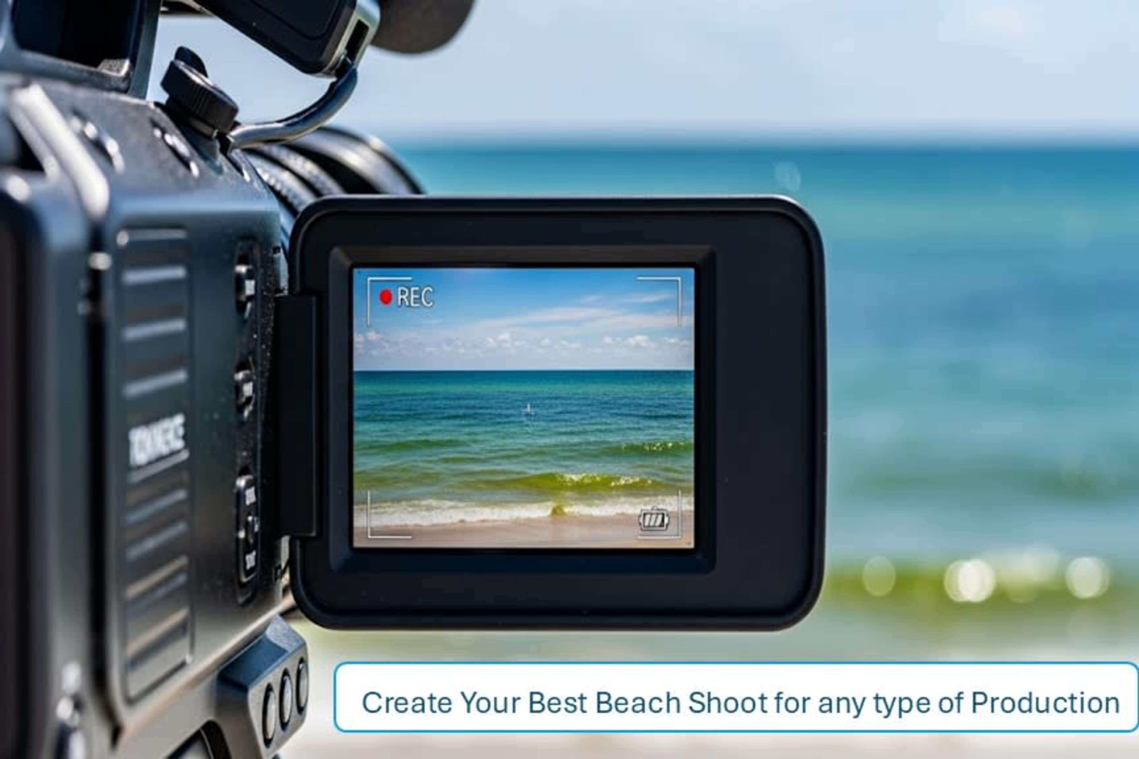 A video camera is focused on a beach scene with clear blue water and a clear sky in the background.