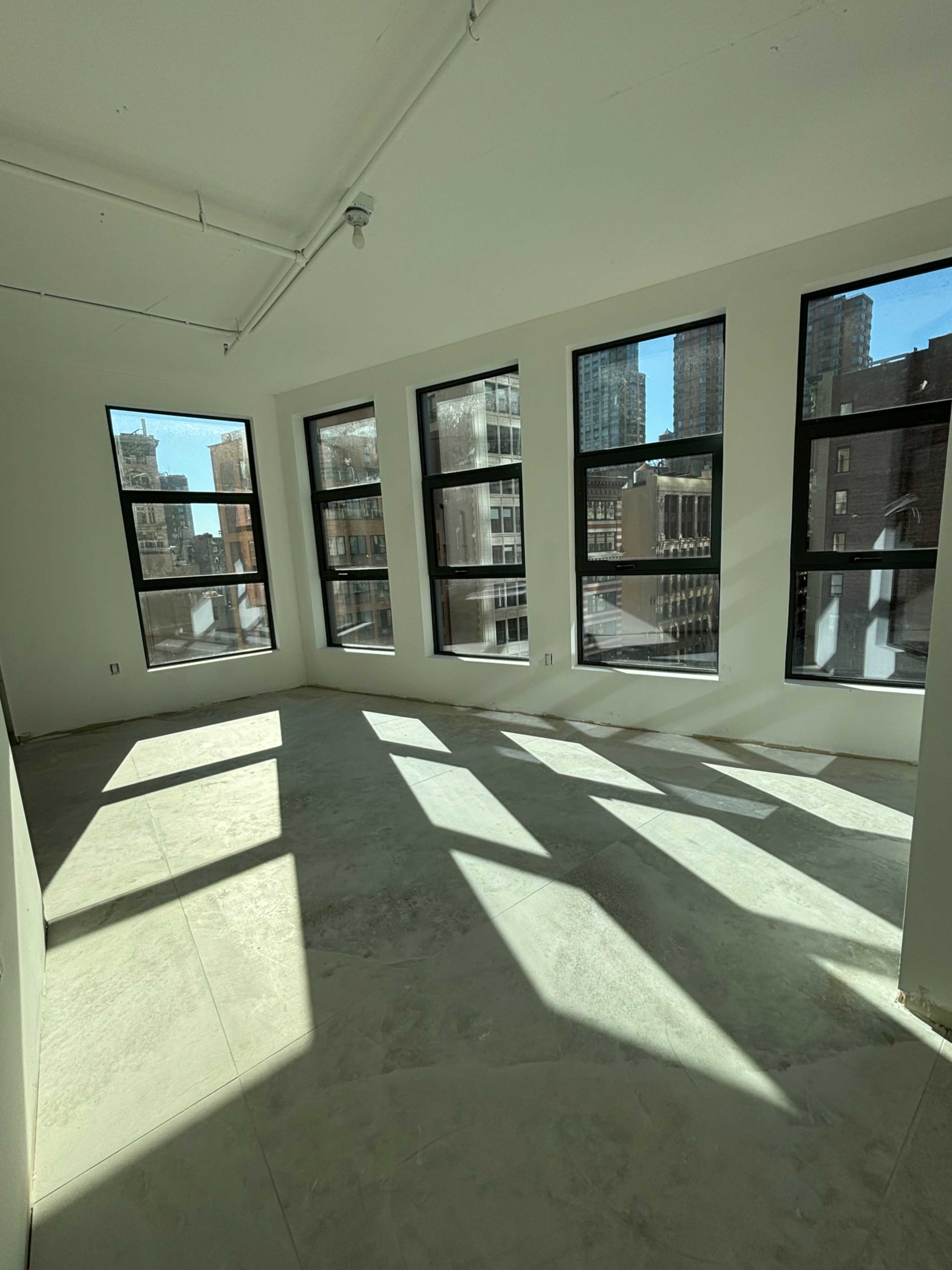 Concrete office space in Nomad; high level w/ multiple windows Image in Midtown Manhattan, New York, NY
