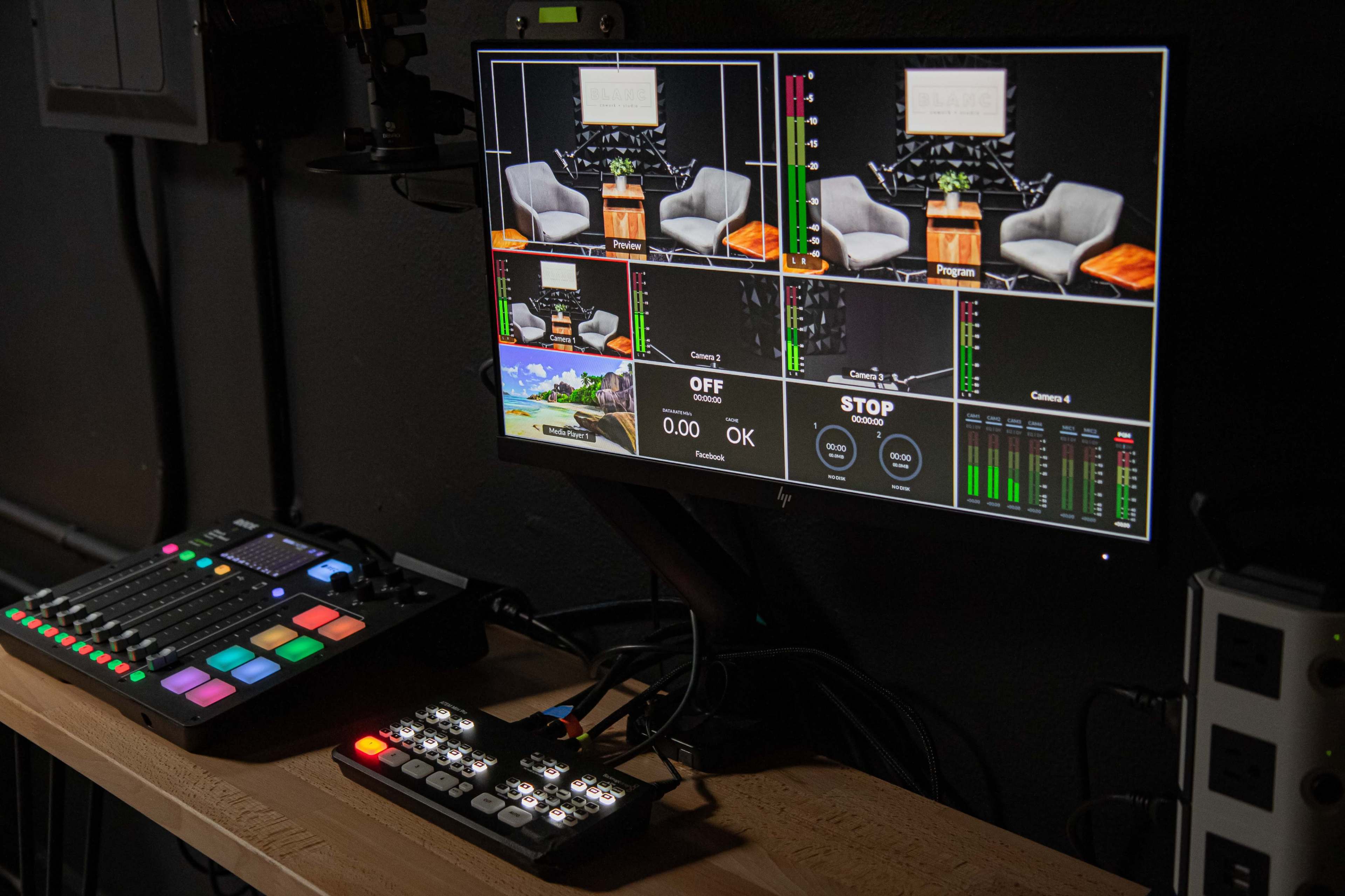 A multi-screen monitor setup displays various feeds and controls from a video production studio.