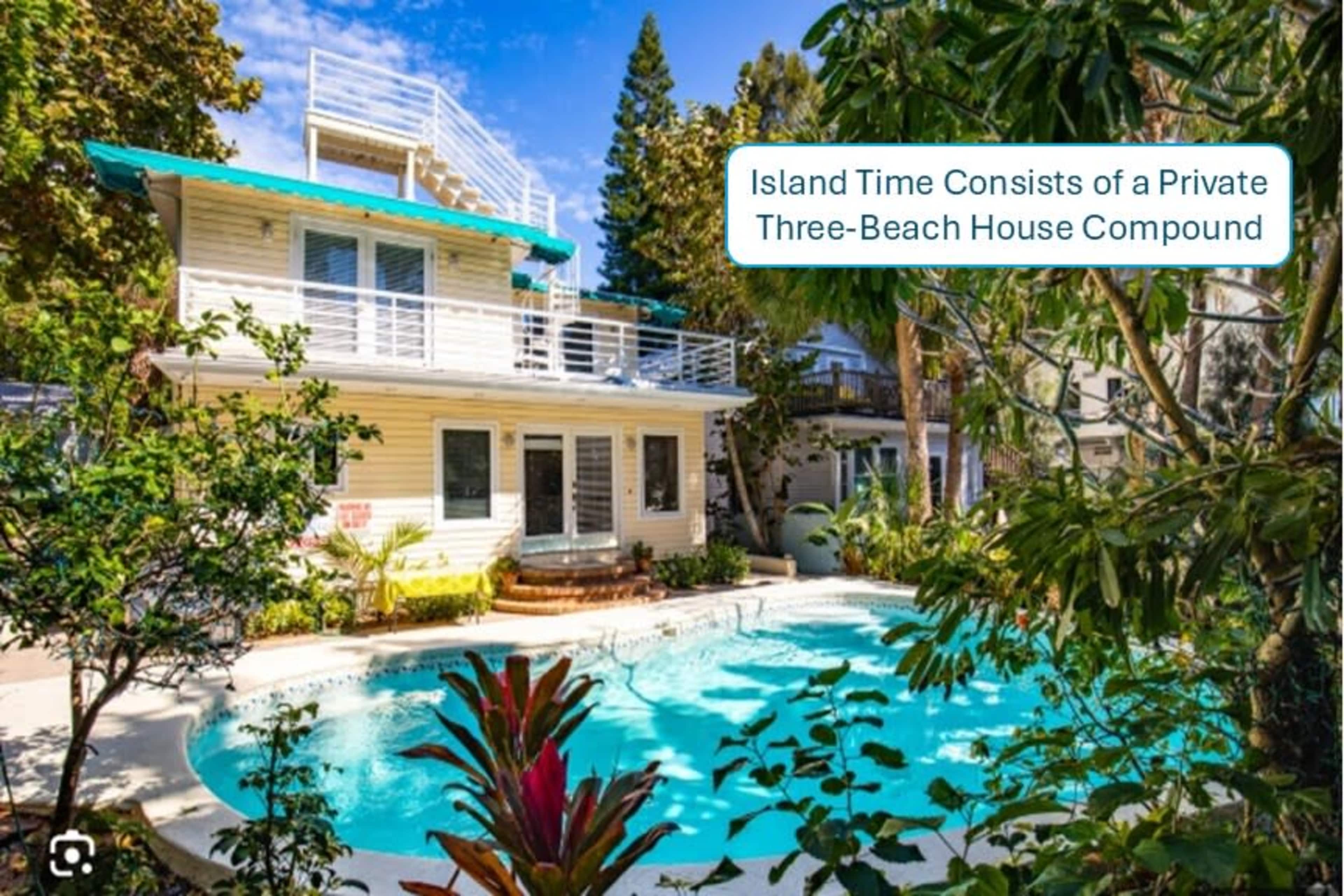 The image shows a private beach house compound with a swimming pool surrounded by lush greenery.