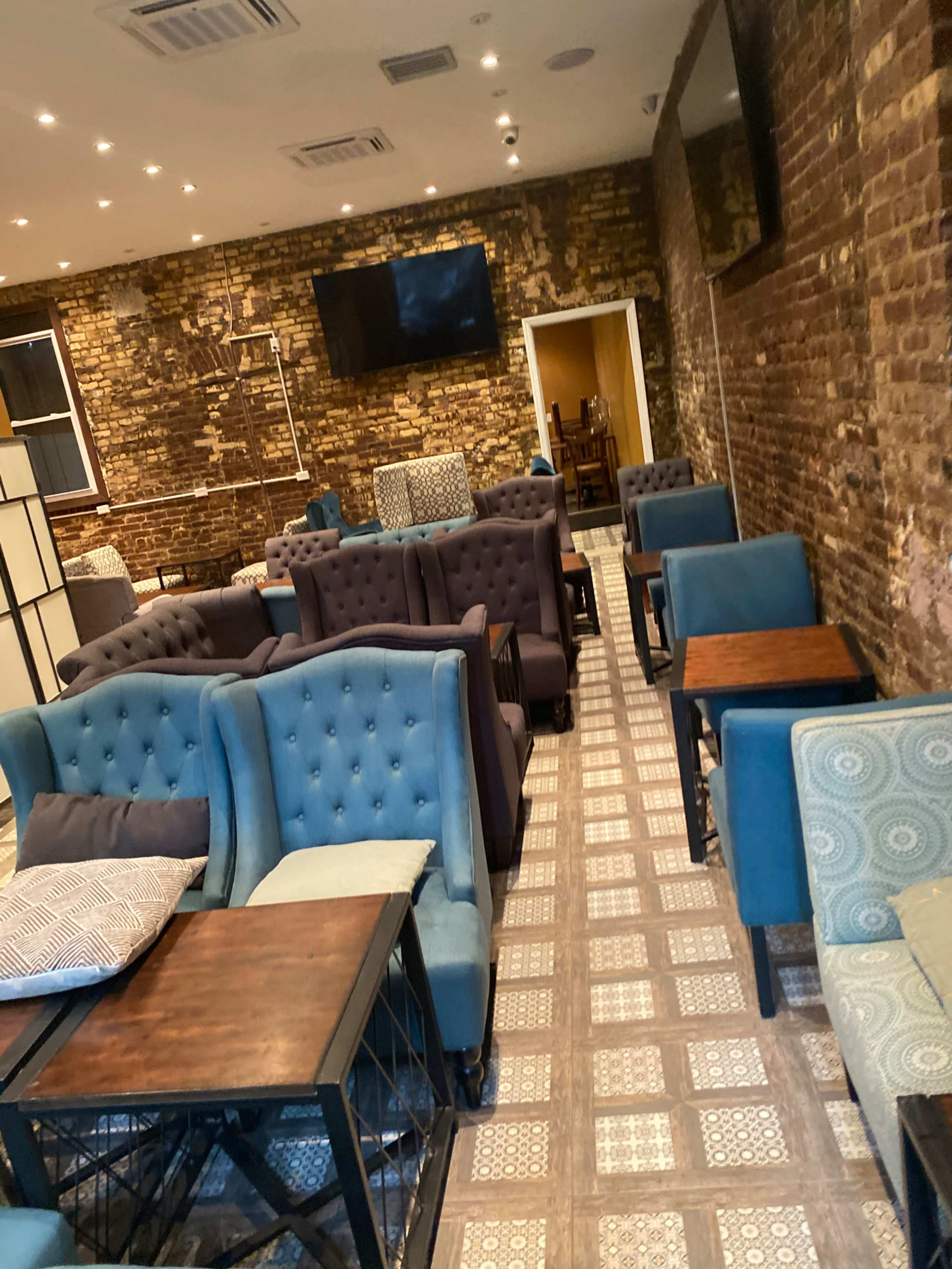 Cafe Lounge with lots of TVs and couches Image in West Bronx, Bronx, NY