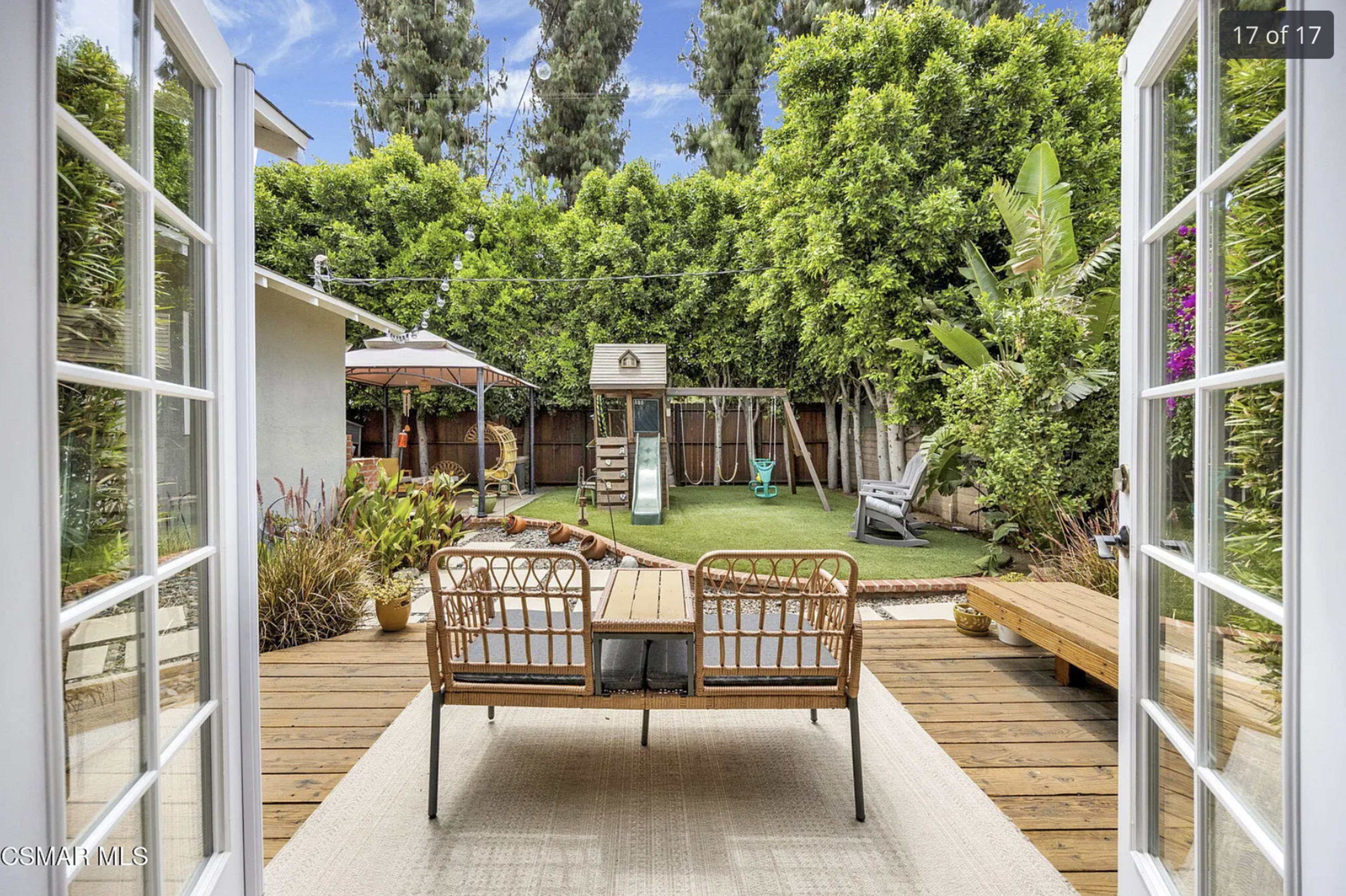 A backyard showcases a playset, a swing, and a landscaped area, with patio furniture visible in the foreground.