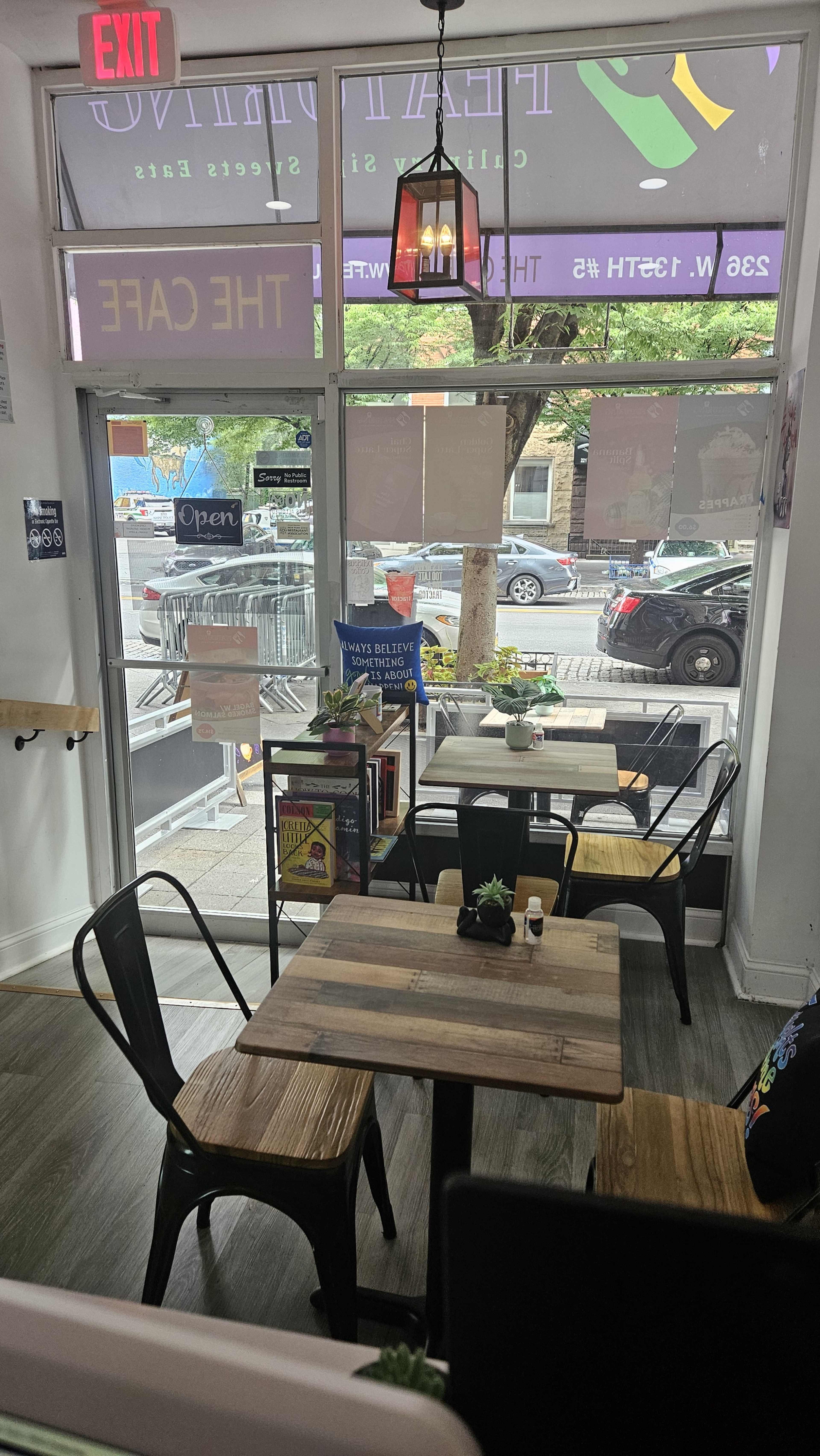 Harlem business and residential street, next to a NYPD Precinct, warm and cozy decor, inspiring manifestation of dreams. Image in Harlem, New York, NY