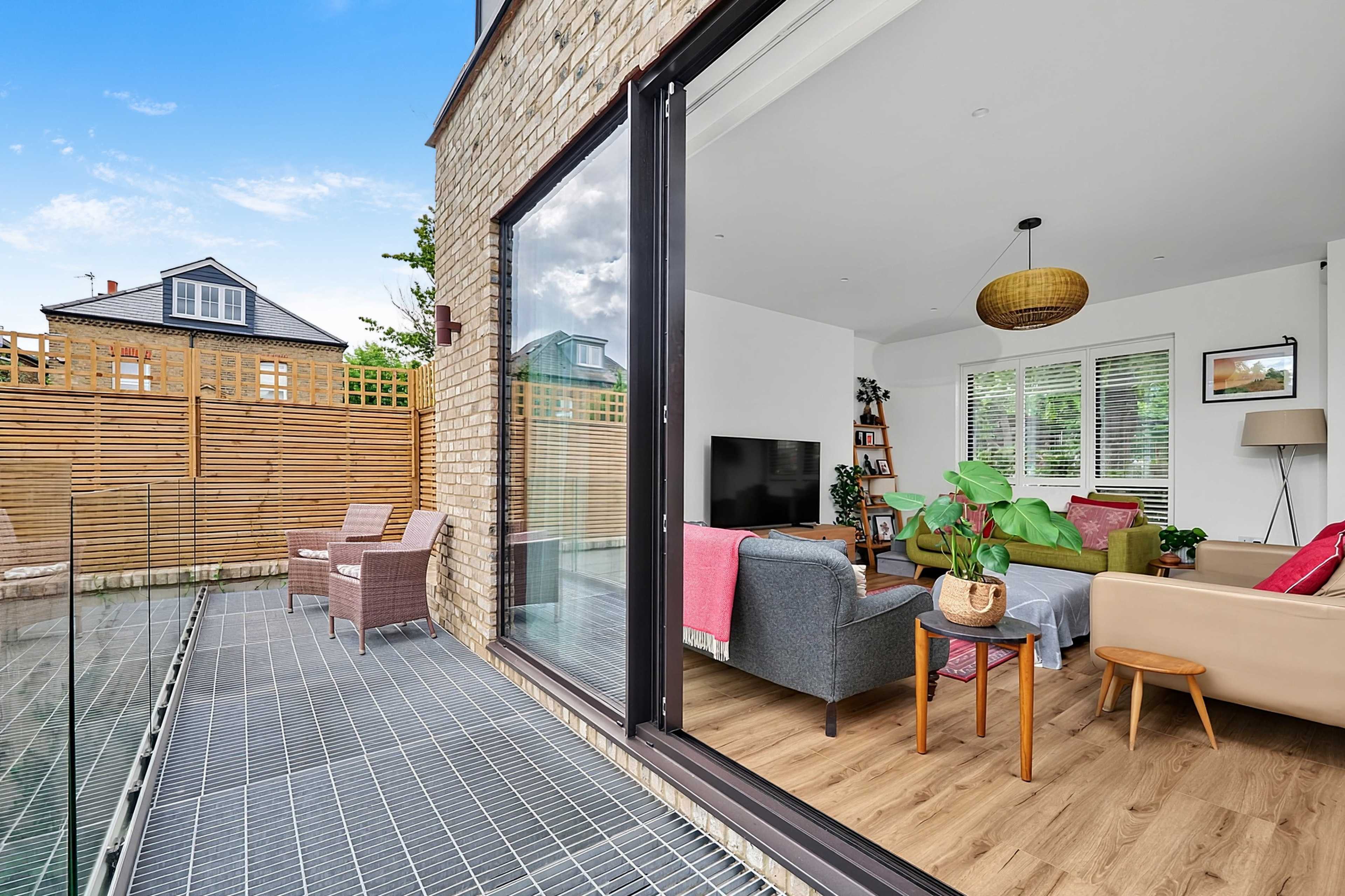 Architect Designed Modern Home with Panoramic Glass, Sunken Courtyard, Feature Brick Wall and Log Burner Image in London, London, ENG