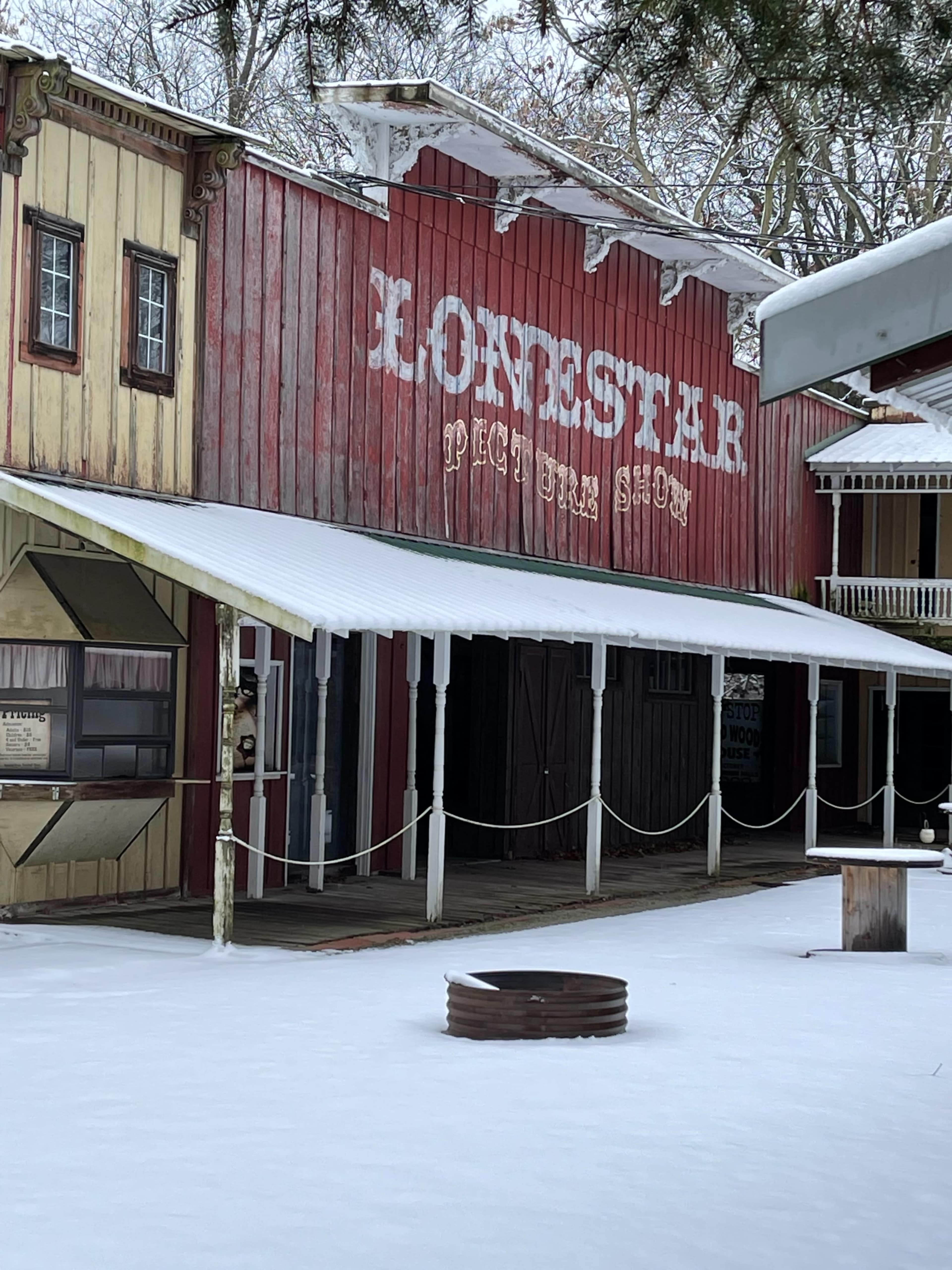A western-style storefront with a sign that reads "Lone Star" in a snowy setting.
