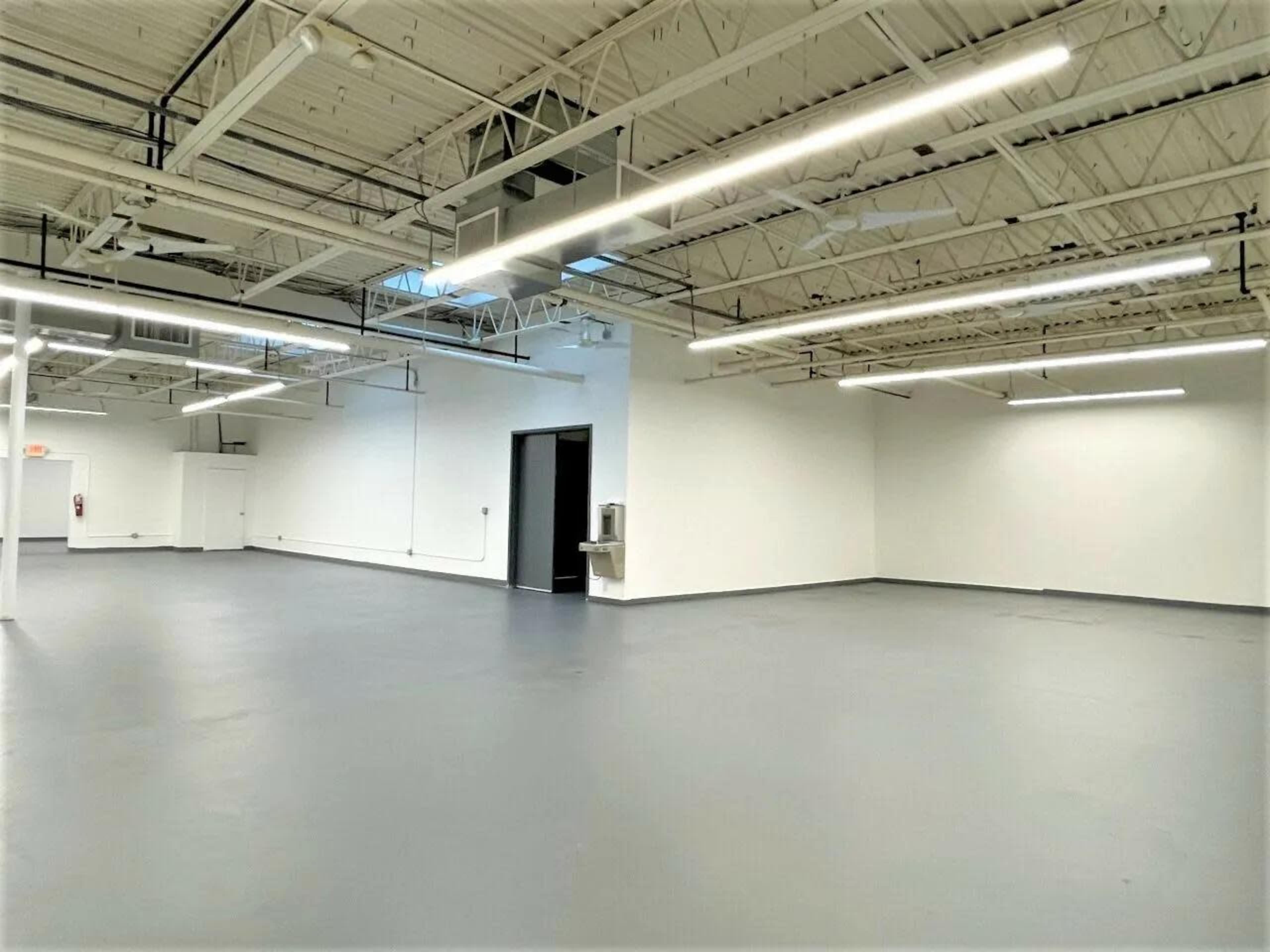 Open-Concept Industrial Hall Image in Ward Two, Somerville, MA