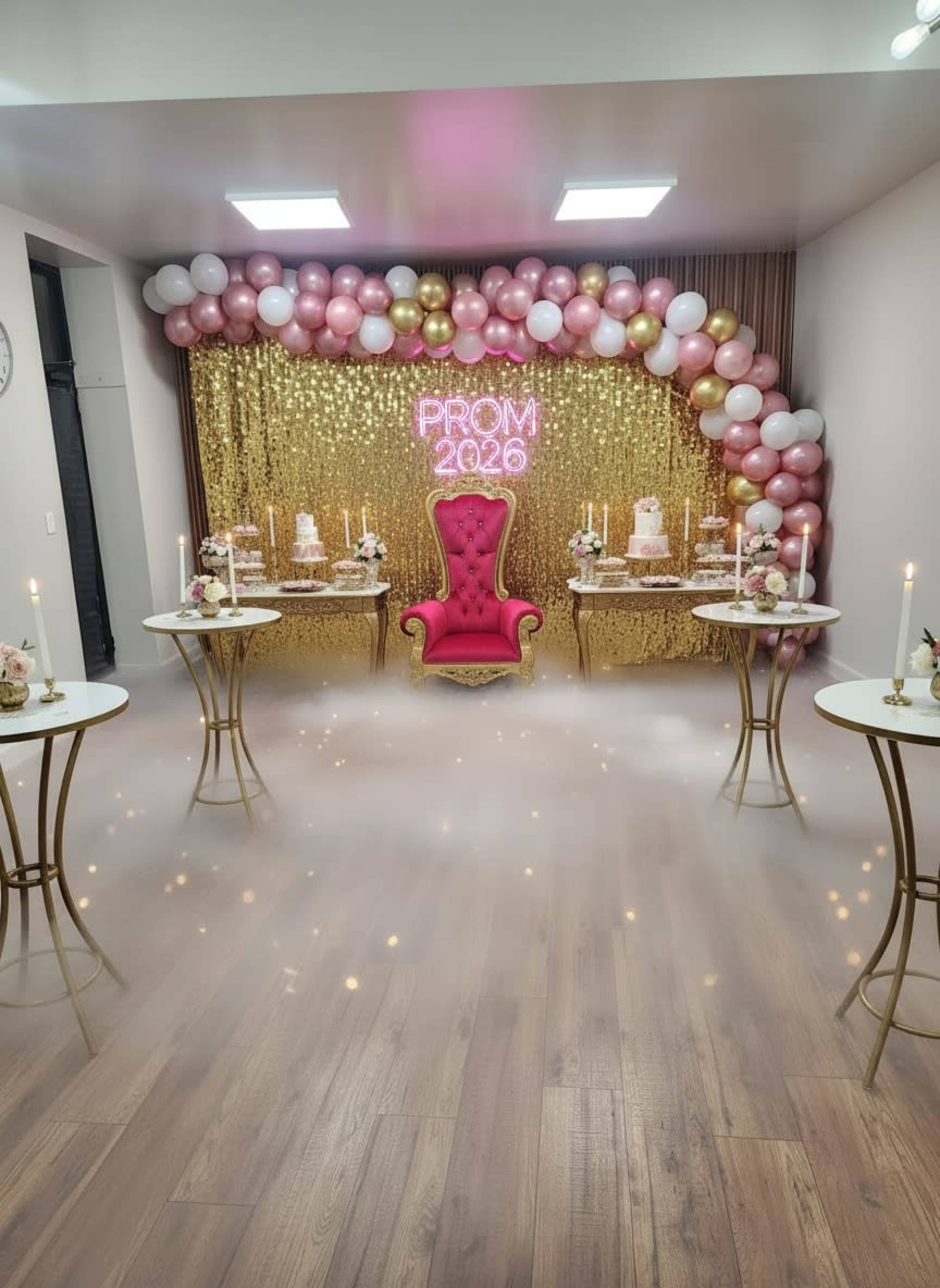 The image shows a decorated event space for a prom, featuring a pink throne, a shimmering gold backdrop, and balloons in pink and gold arranged above.