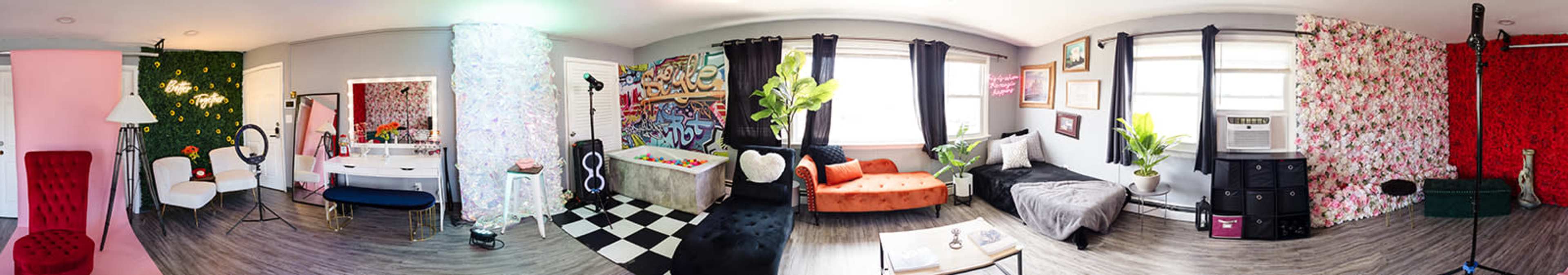 A panoramic view of a creatively designed room featuring a mix of colorful decor, furniture, and various wall patterns.