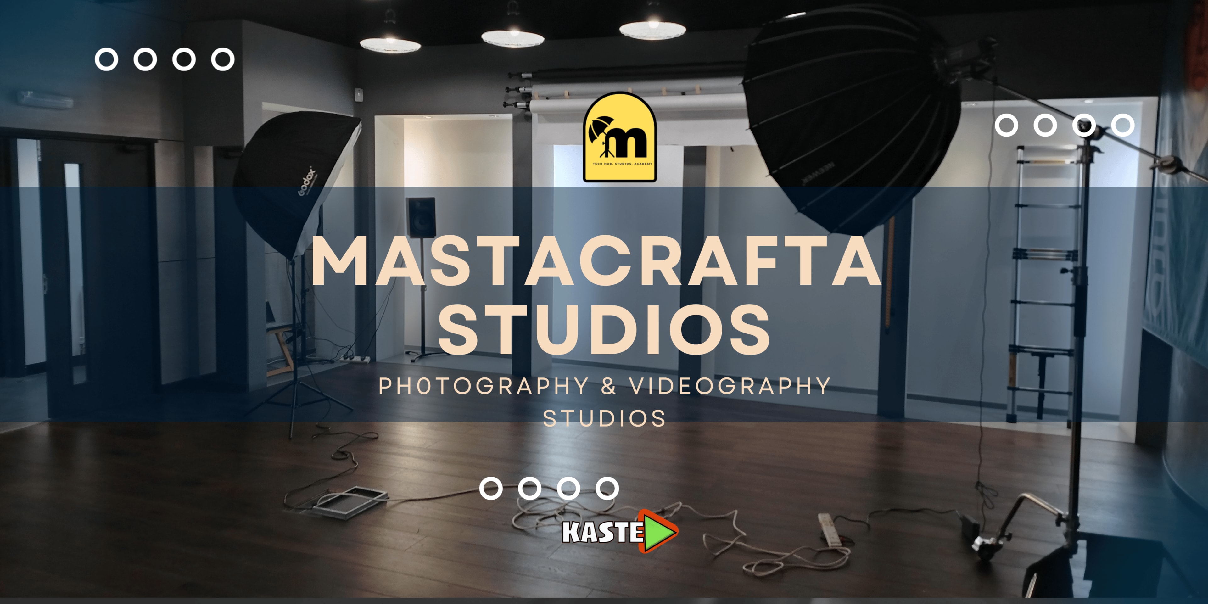 The image displays a photography and videography studio with professional lighting equipment set up in a spacious room.