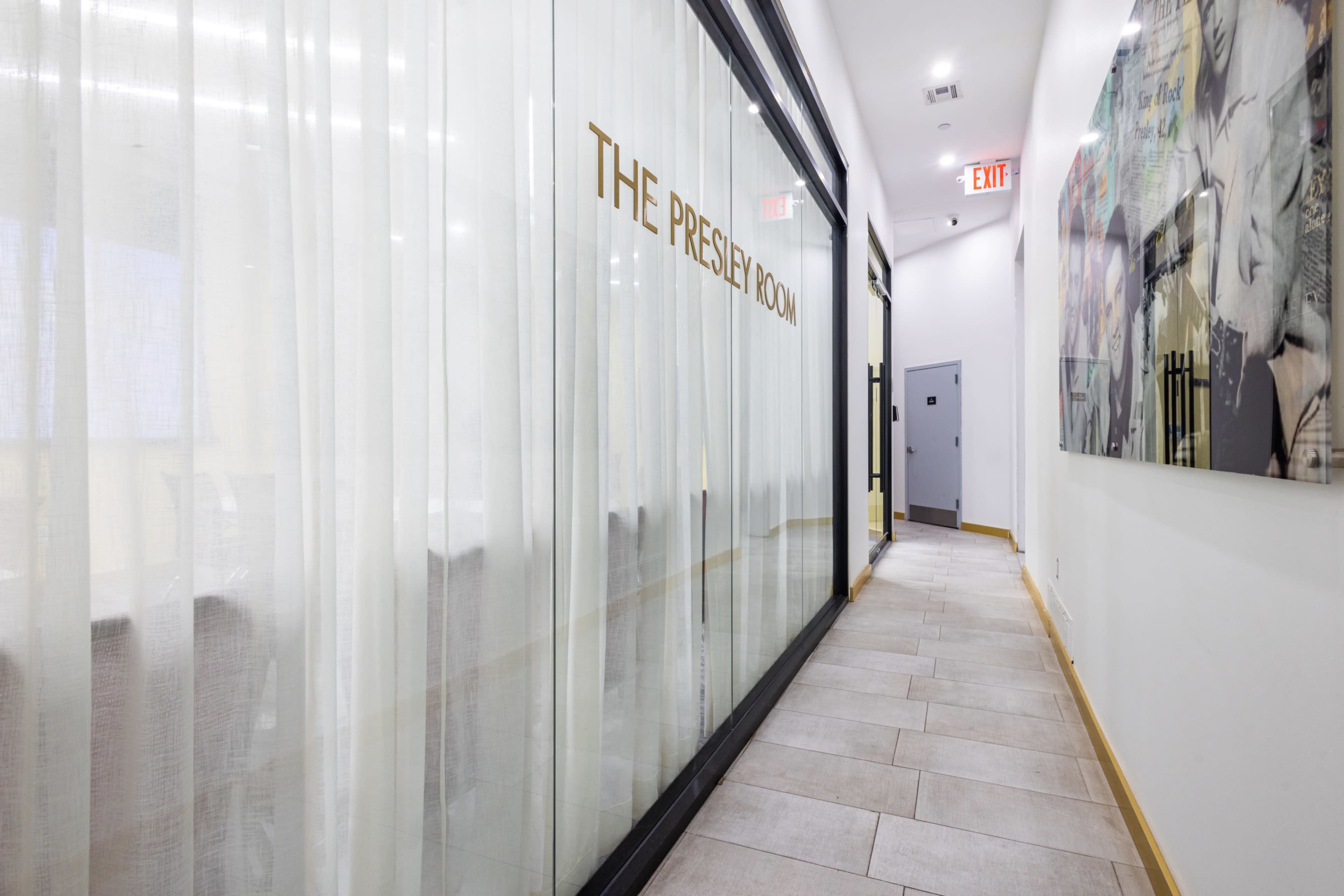 A narrow hallway features a frosted glass door marked "THE PRESLEY ROOM" and is lined with light-colored walls and tiles.