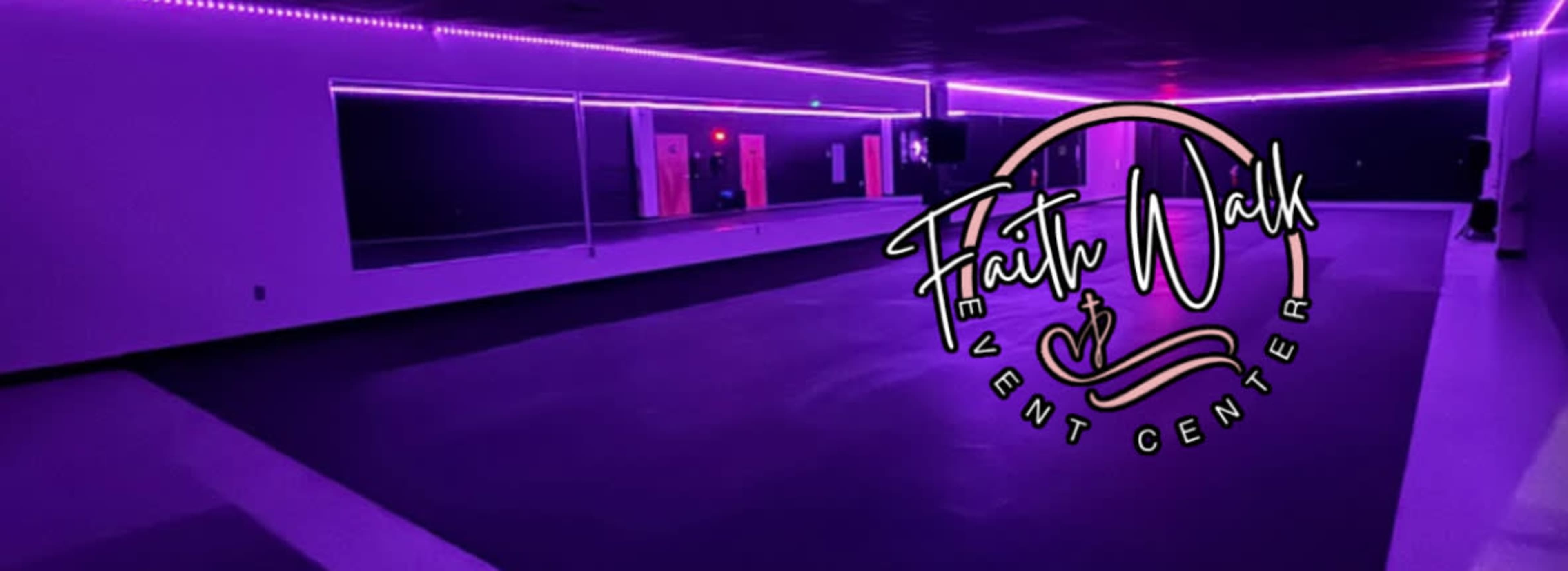 The image shows a spacious event center with purple ambient lighting and a large mirrored wall.