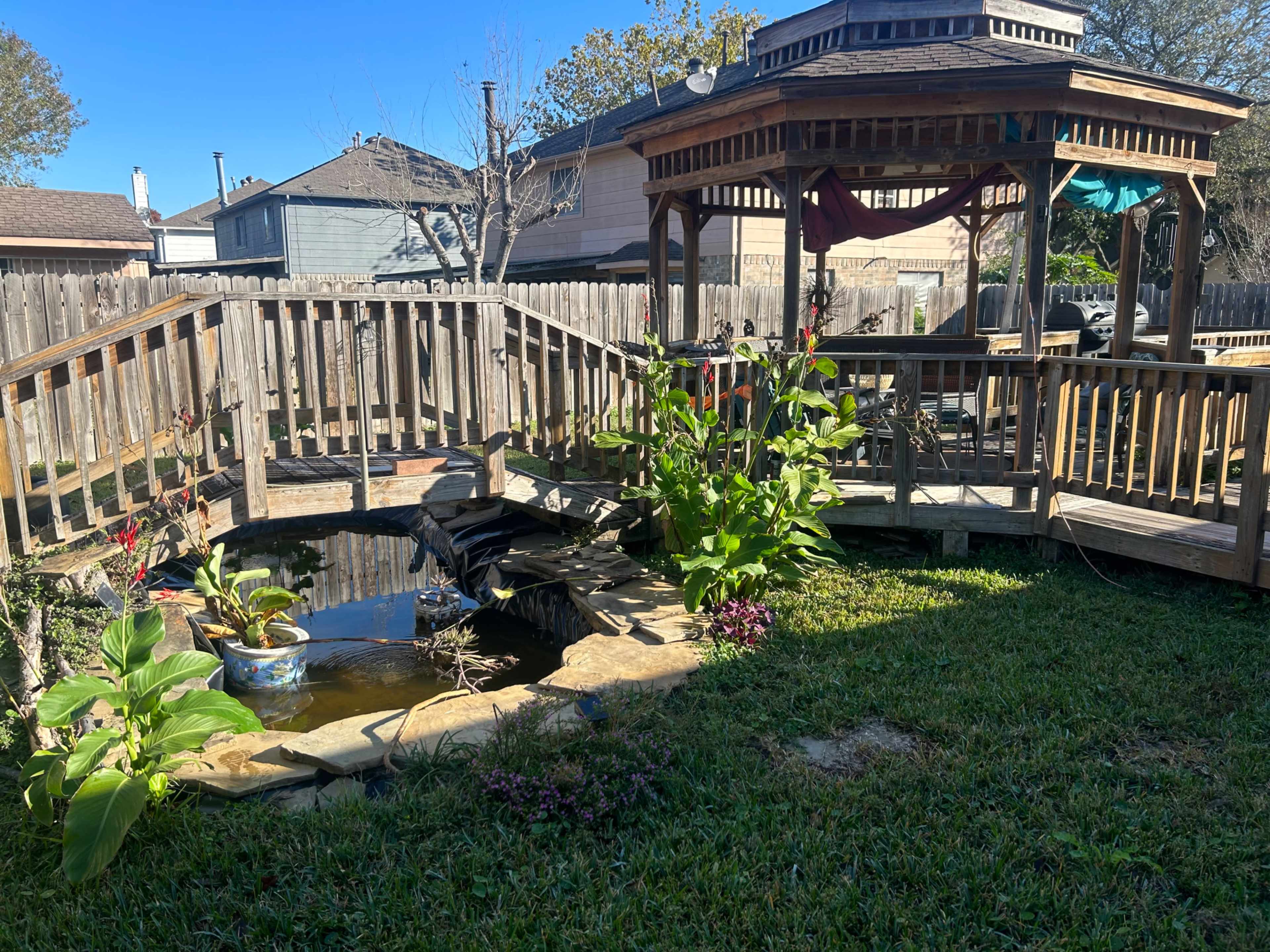 Picturesque private yard with gazebo, deck and small pond. Image in Inwood Northwest, Houston, TX
