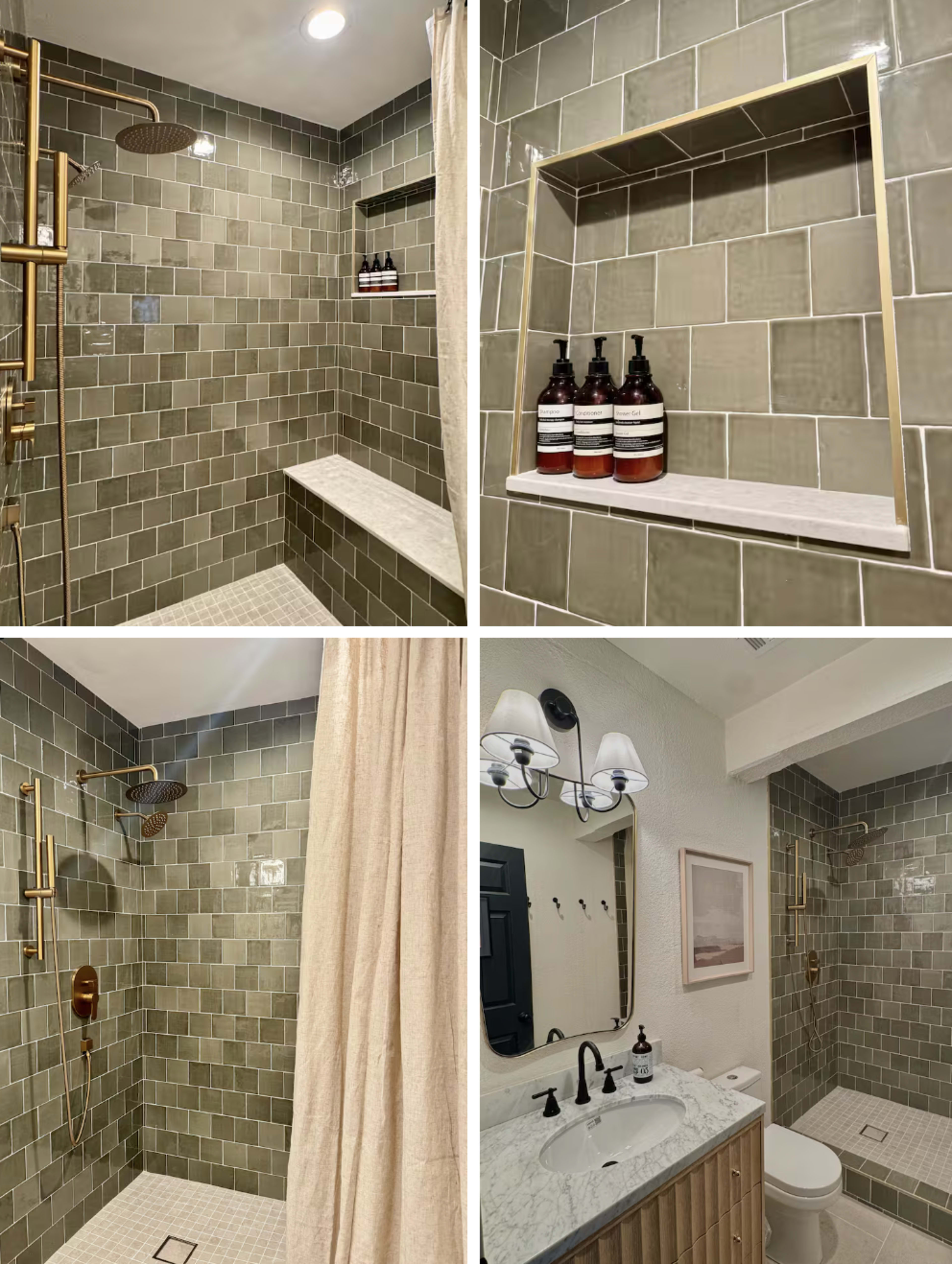 The image shows a modern bathroom featuring two shower areas with green tiled walls, a wall-mounted shelf with dark bottles, and a separate vanity area with a sink, mirror, and light fixtures.