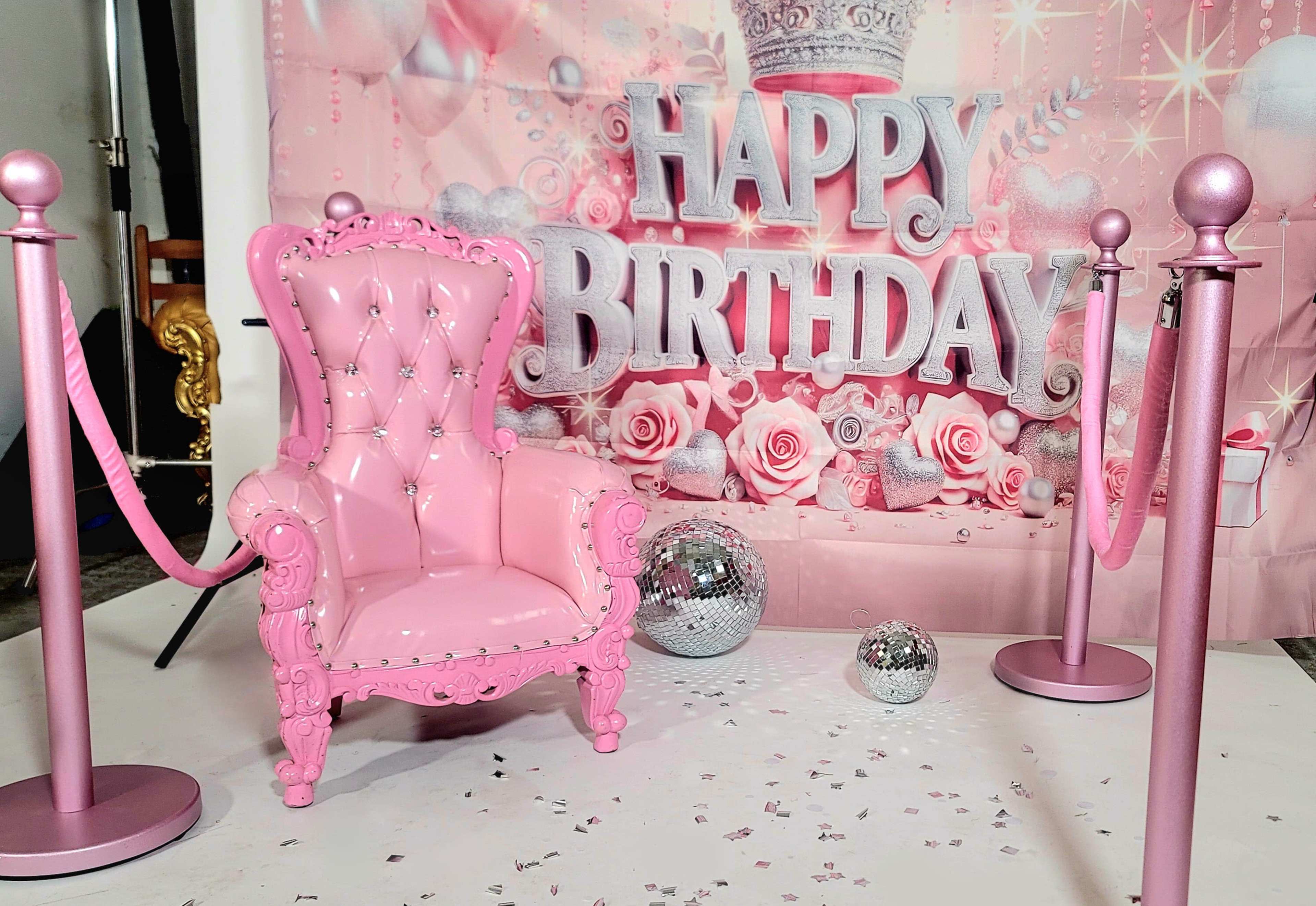The scene features a pink throne chair surrounded by velvet ropes and disco balls, set against a backdrop that says "Happy Birthday."