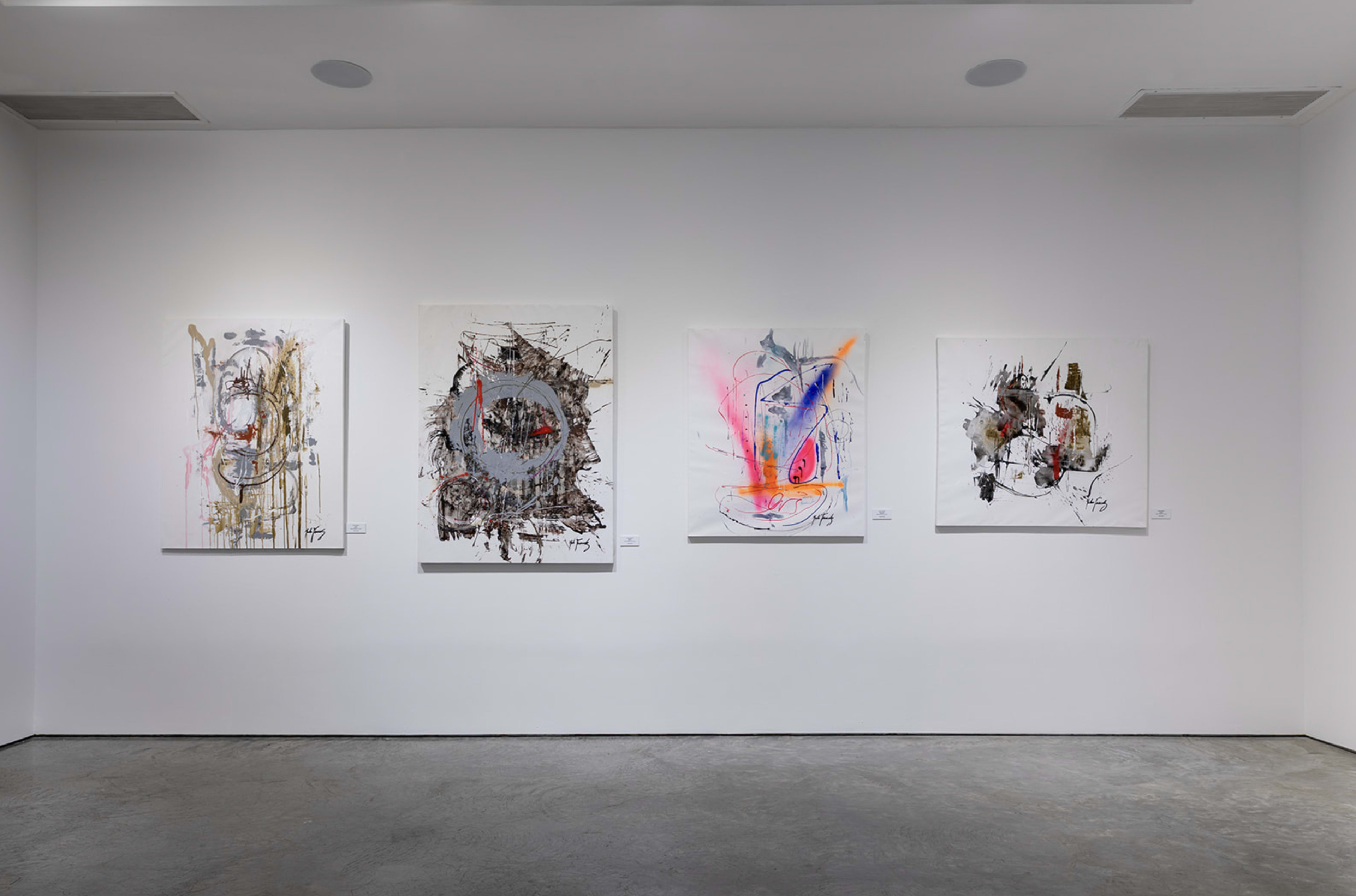The image shows a gallery wall displaying five abstract paintings arranged in a line, with each piece featuring vivid colors and distinct artistic styles on white backgrounds.