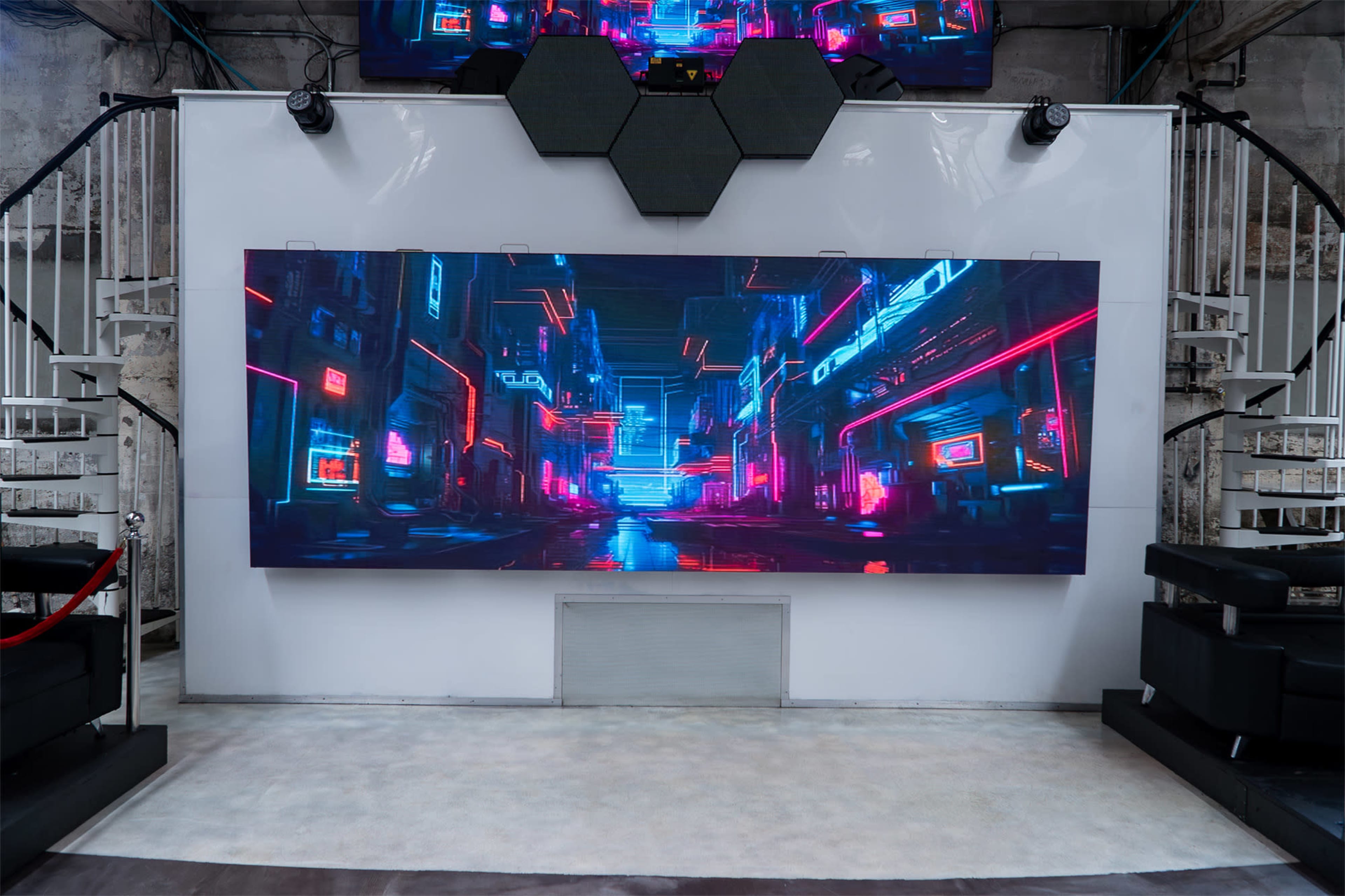 A large digital display shows a futuristic cityscape with neon lights and darkened streets.
