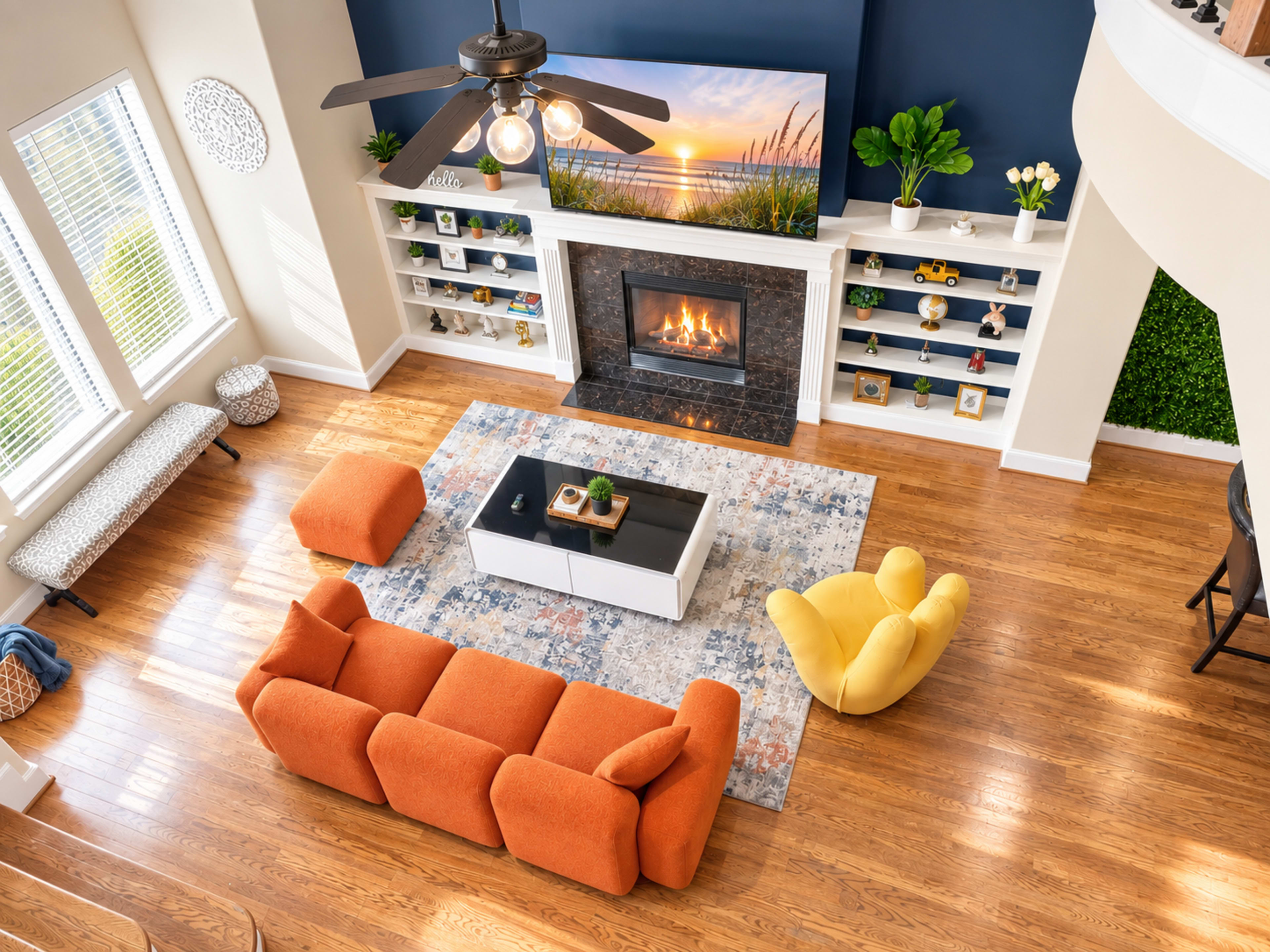 The image shows a modern living room with a large, wall-mounted television above a fireplace, surrounded by shelves, colorful furniture, and hardwood flooring.