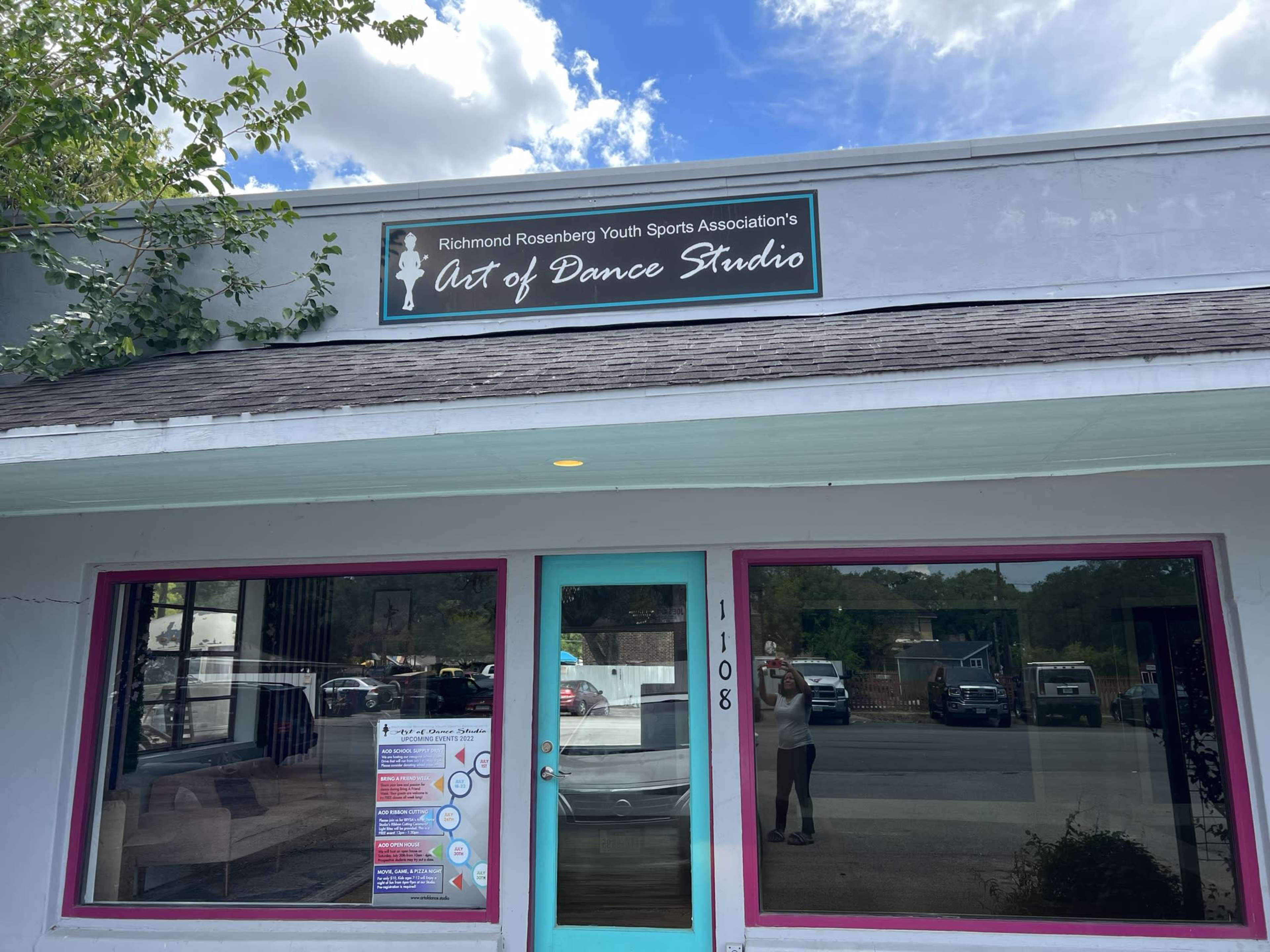 The exterior of the Art of Dance Studio, a building with a sign and a bright-colored trim, located at 1108.