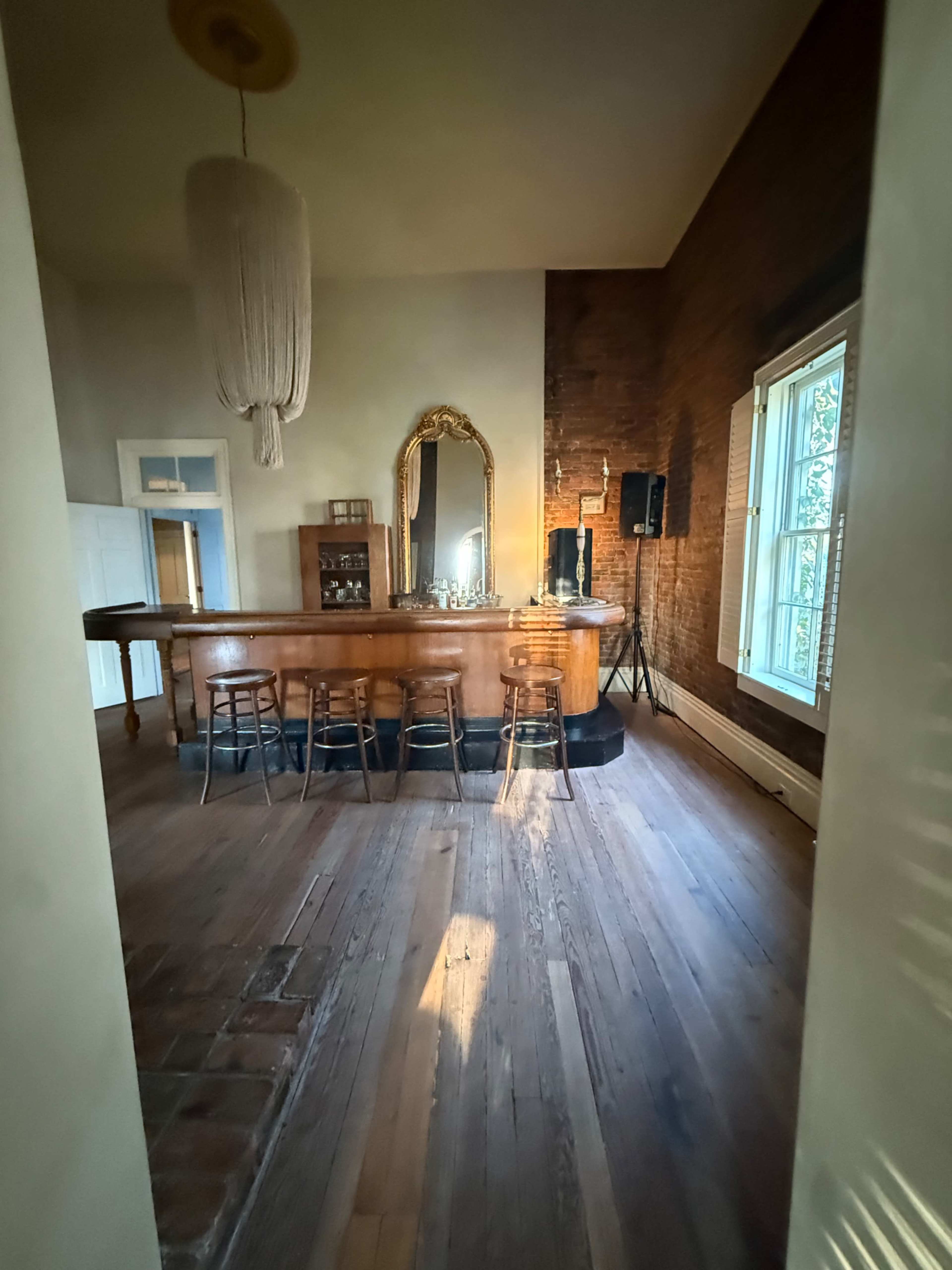 Brick Victorian with wrap around porch and exposed brick interior. Image in East Nashville, Nashville, TN