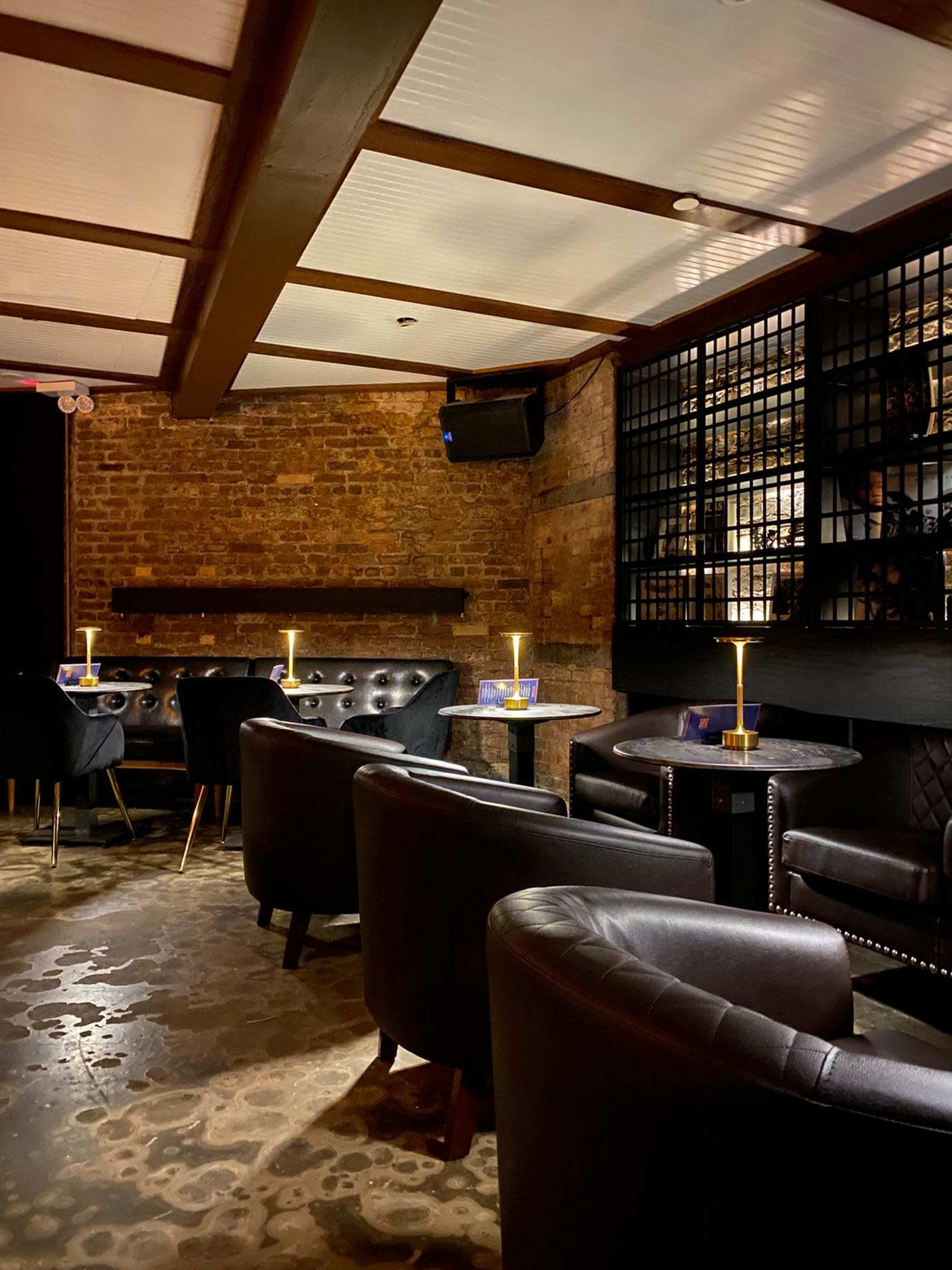 Intimate refined lounge with exposed brick in Park Slope Image in Park Slope, nyc, NY