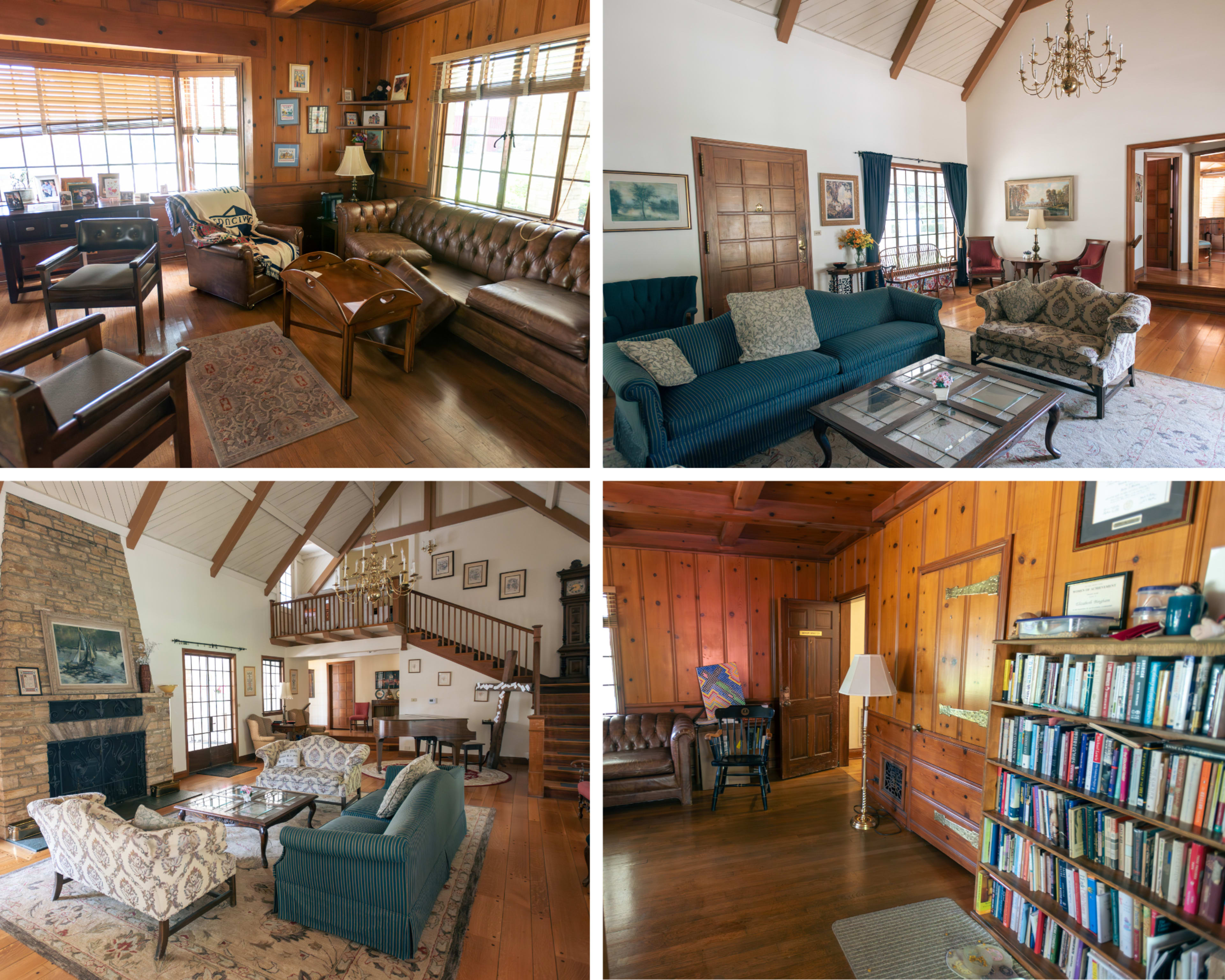 A spacious, wooden-paneled living room with various seating arrangements, decorative items, and a central fireplace.