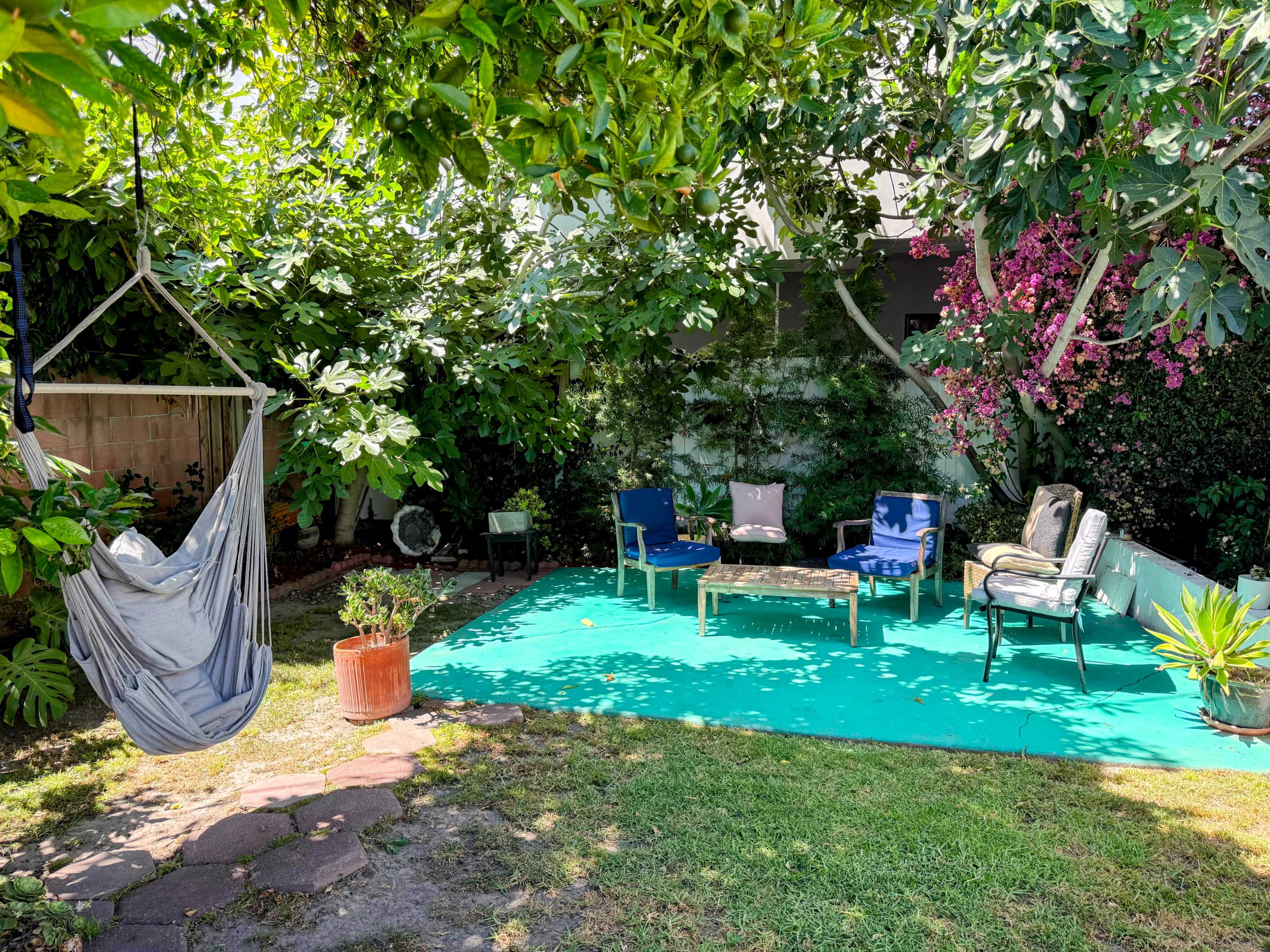 Zen Backyard filled with plants and fruit trees near DTLA Image in Jefferson Park, Los Angeles, CA