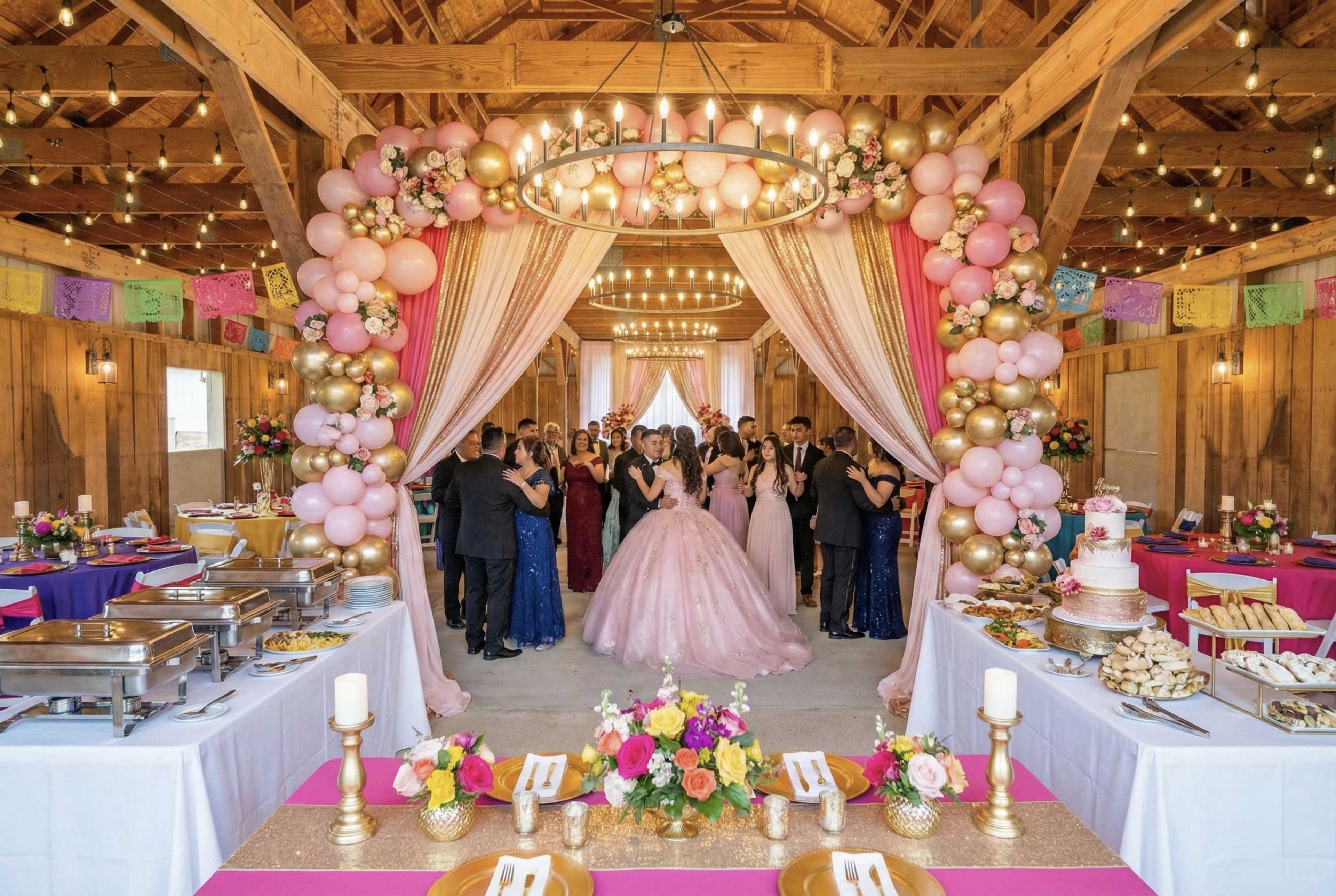 The image depicts a festive indoor event space decorated with balloons and floral arrangements, where guests are gathered in formal attire, celebrating a special occasion.