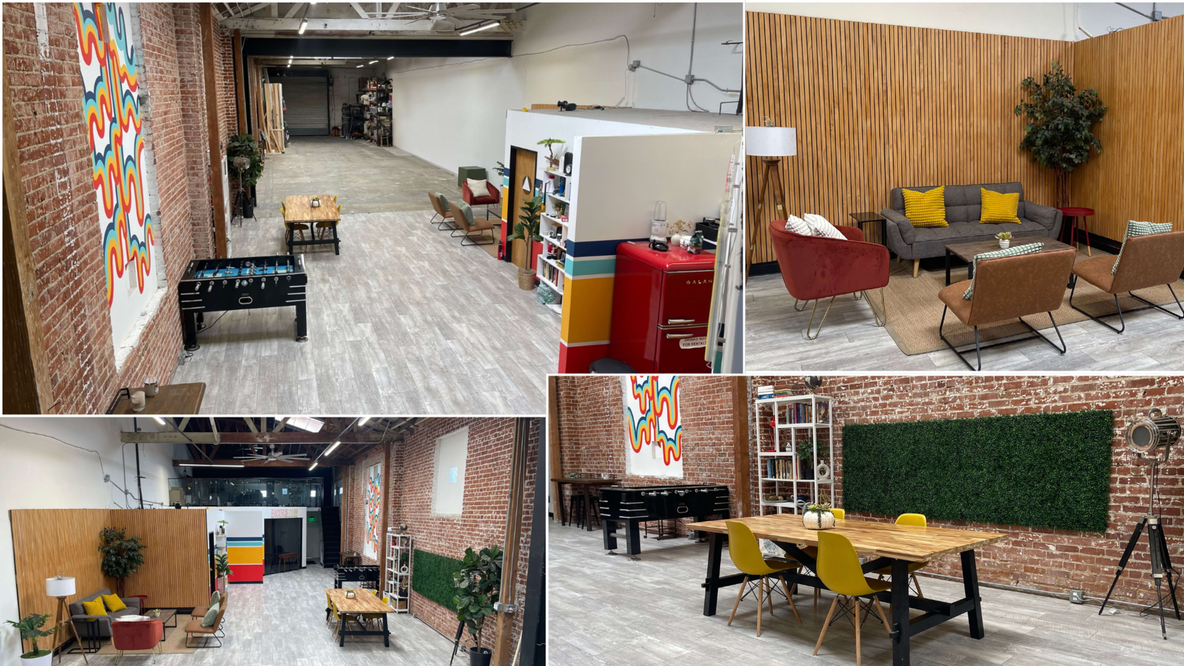 An industrial-style workspace with exposed brick walls, a variety of seating areas, and colorful decor, including a ping-pong table and a dining table.