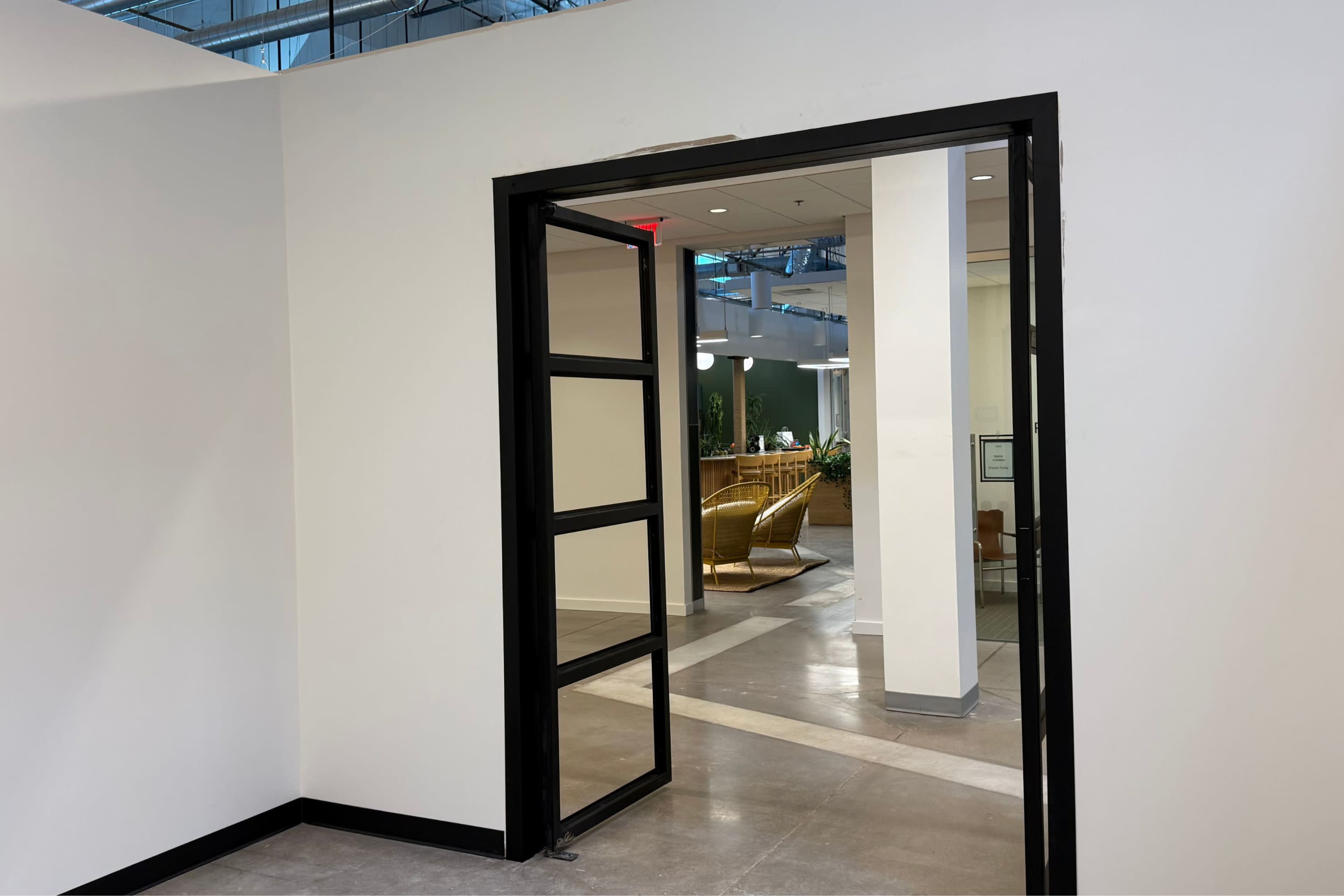 Sleek Warehouse Showroom (Up to 6 People / 250 sq ft) with Double Aluminum Doors & 14 ft Walls, 10 Minutes from Phoenix Airport Image in South Mountain Village, Phoenix, AZ