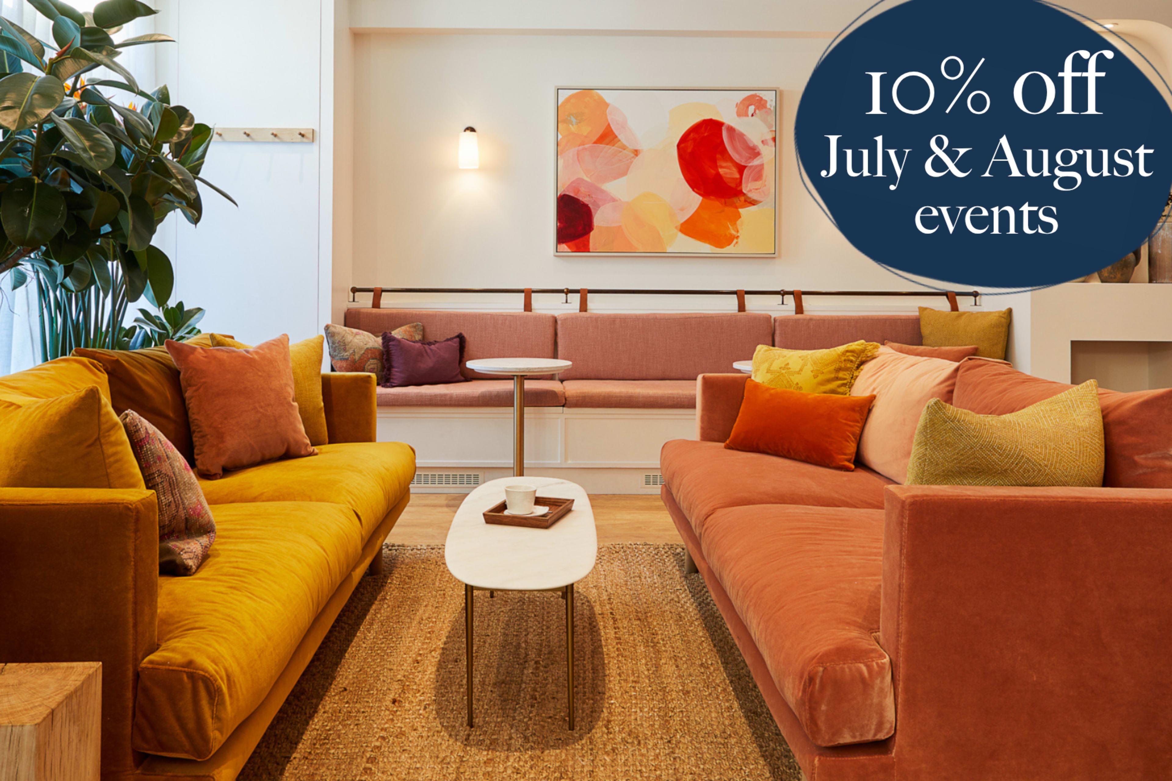 The image shows a stylish living space with two colorful sofas, a small coffee table, and wall art, alongside a promotion for 10% off July and August events.