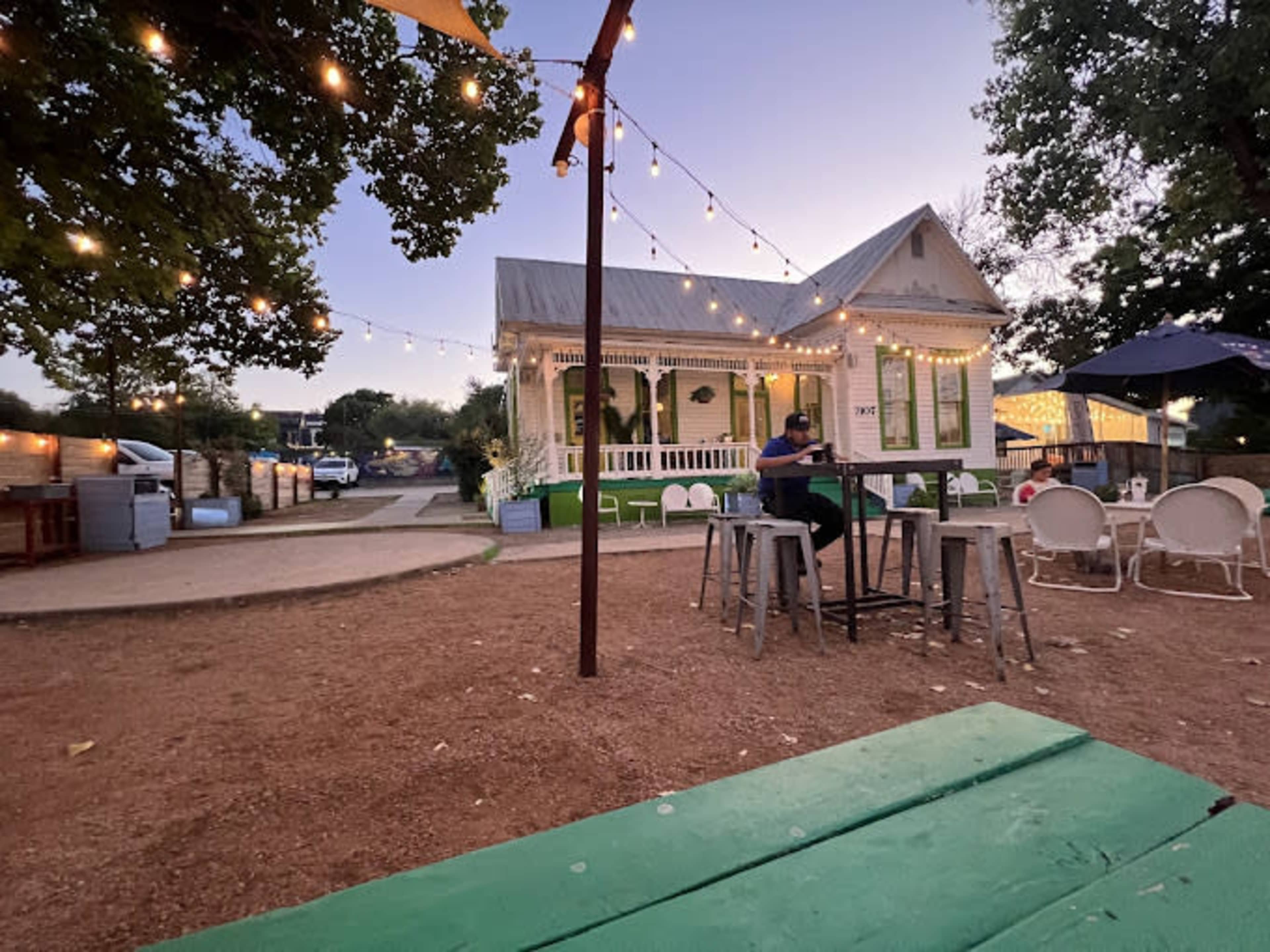Cute historical house with a huge patio and lovely vibes. Image in Montopolis, Austin, TX