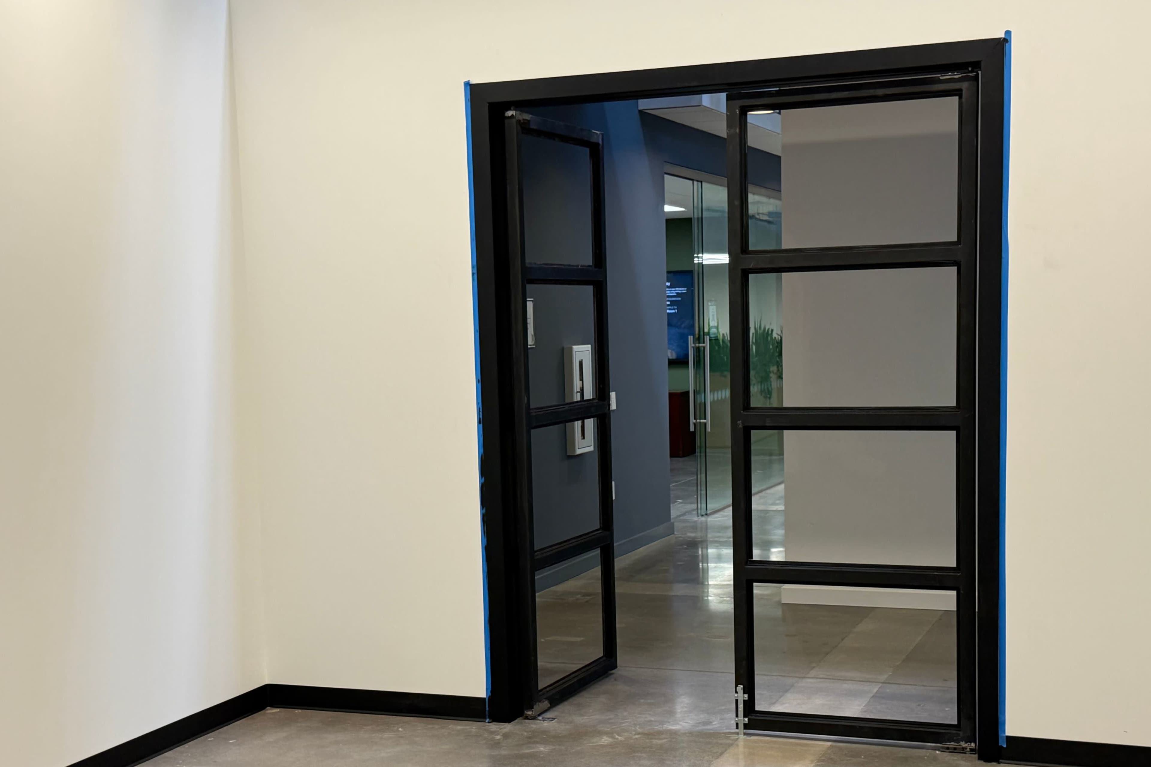 Sleek Warehouse Showroom (Up to 6 People / 250 sq ft) with Double Aluminum Doors & 14 ft Walls, 10 Minutes from Phoenix Airport Image in South Mountain Village, Phoenix, AZ