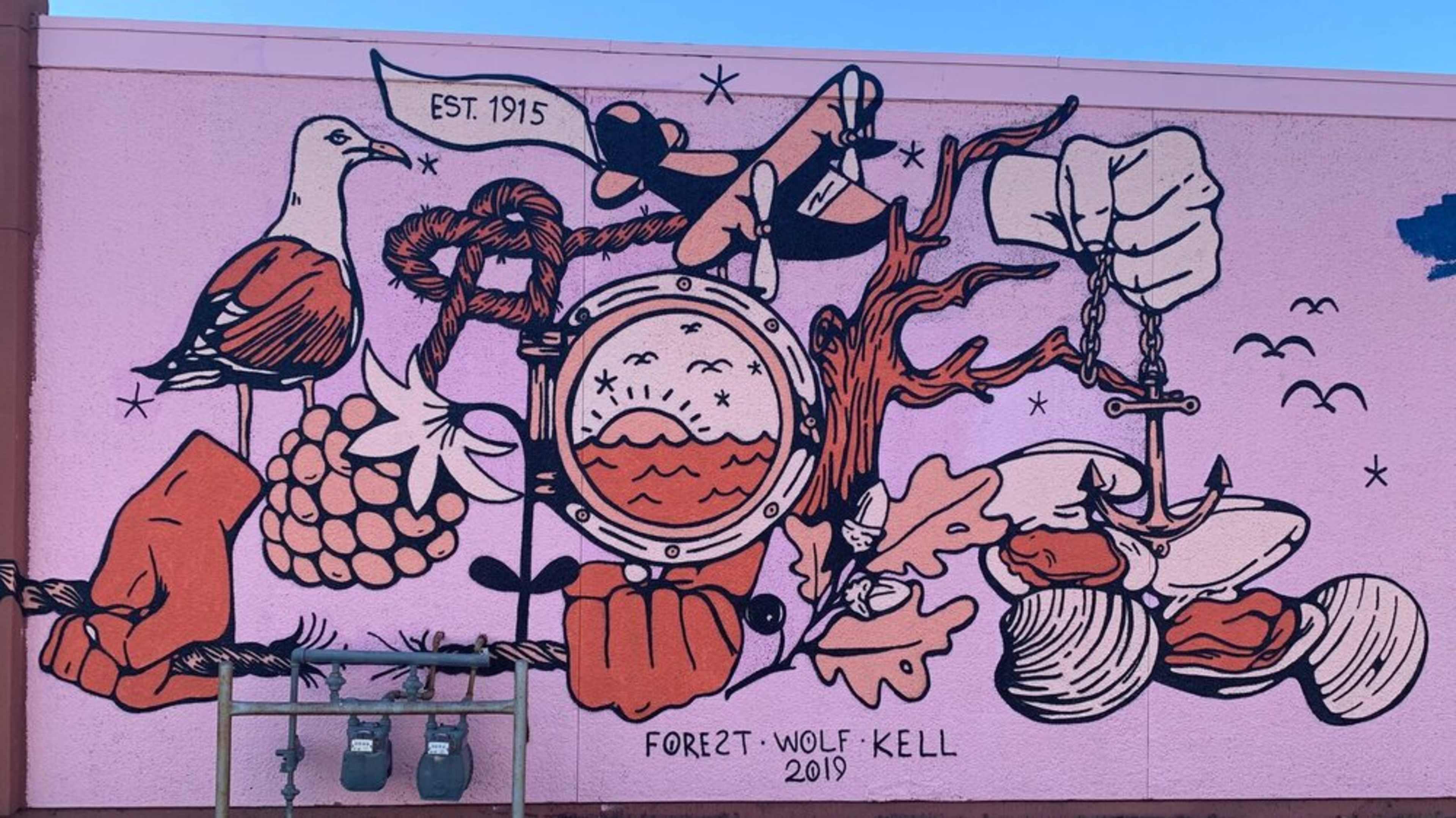 A colorful mural depicting various elements such as birds, grapes, and hands, along with a compass and scales, all intertwined with abstract shapes against a pink background.