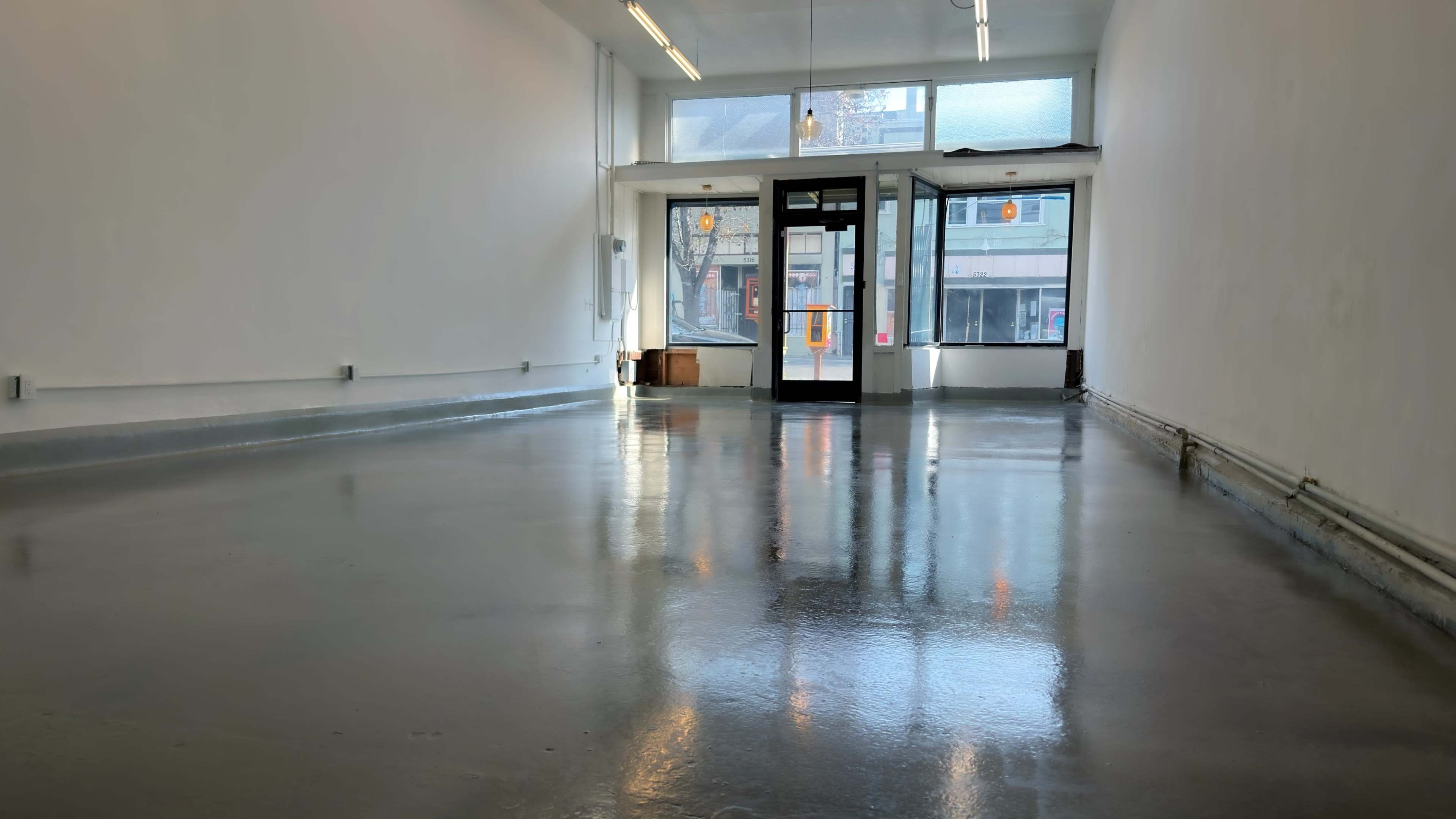 Bright Minimal Storefront Event Space with Polished Concrete Floors Image in , Oakland, CA